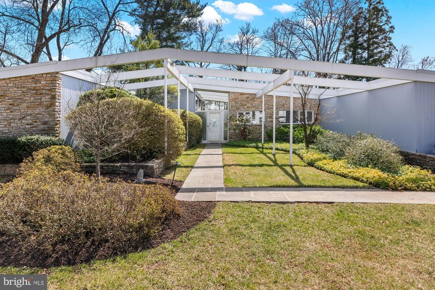 Move right into this fabulous, updated Mid-Century Modern Rancher, in the desirable Dumbarton neighborhood, in Pikesville, where classic design meets modern sophistication. This home offers an exceptional blend of timeless elements and contemporary upgrades, creating a truly unique living experience. The Main Level features a grand entrance with beautiful slate floors that leads into a spacious and bright Living and Dining Room with vaulted ceilings, featuring new glass-paneled windows and sliding doors that open to a magnificent covered porch and beautifully landscaped and sprawling backyard with a quaint garden and pond, creating a seamless connection to outdoor living, while filling the home with lots of natural light. A grand Family Room, with a hidden wet bar, custom built-ins, stunning hard wood and slate floors, and magnificent double wood doors with exquisite, detailed iron handles, adds a unique flair to the living spaces, ideal for entertaining, offering plenty of space for social gatherings and fun-filled evenings. Features also include a light-filled Den, with lots of built-ins and a state-of-the-art sound system, providing a perfect retreat. The exposed brick accents, heated floors, and three gas fireplaces, provide warmth and character throughout the home. The Main Level also includes a gourmet Kitchen that has been beautifully updated with stunning granite countertops, top-of-the-line appliances including a Subzero refrigerator, double oven, gas cooking and plenty of hardwood cabinets. In addition, a laundry area and large walk-in pantry adds extra convenience and space. The spacious Primary Bedroom is a serene sanctuary with a luxurious en-suite bathroom, a dressing area, and a spacious walk-in closet. Two additional generously sized bedrooms and a vintage-inspired Hall Bath provide comfort and style for family and guests.  The 4th Bedroom with an en-suite bathroom provides privacy for guests and is a perfect in-law suite. A large Workshop Room with double glass doors to the backyard can be converted into an office, playroom or additional bedrooms. Other features include a spacious heated 2-car garage, a powder room, 2 cedar closets, a Geothermal HVAC System, house generator, storage shed, newer roof (2022), sewer (2020) and waterline (2021), enhancing the functionality and efficiency of the home.