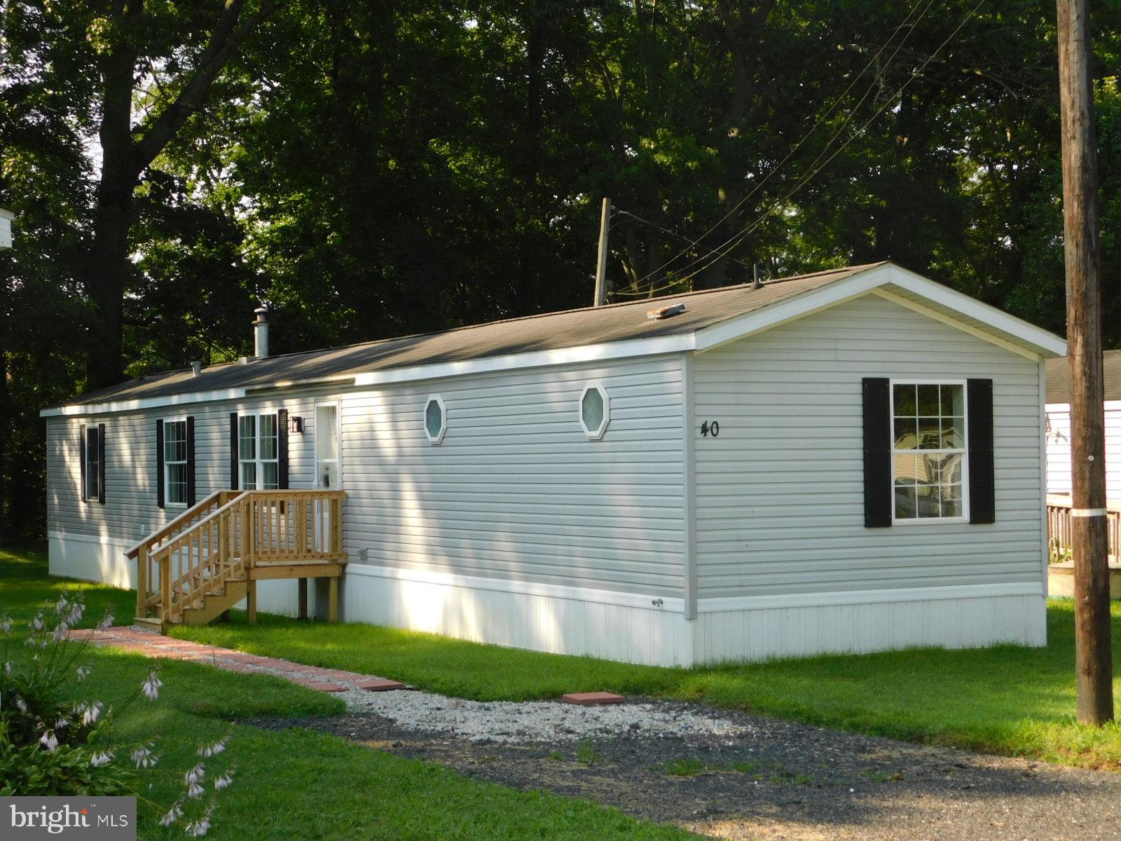 Just renovated and looking for a new owner! Fresh paint, new flooring, updated kitchen and baths. Three bedrooms and two baths in the 1216 sq ft home. Main bedroom includes a private bath. Kitchen includes new gas range, new refrigerator, new dishwasher. Skylights brighten the workspace! Updated Propane heating and Central air for climate control. August Promo: Six months FREE LOT RENT for purchasers who close by August 31st.