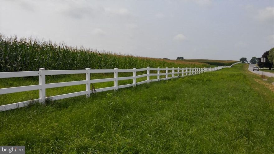 30.47 beautiful acres with views in all directions.Clean&Green! Two approved driveway entrances. White vinyl fencing covers the over 2000 ft of road frontage. Huge 45x60 pole building with 4 in. thick concrete floor.Well on property. Perc approved yrs ago so may need to be perc approved again. Farmer across the street currently leases the land from year to year.