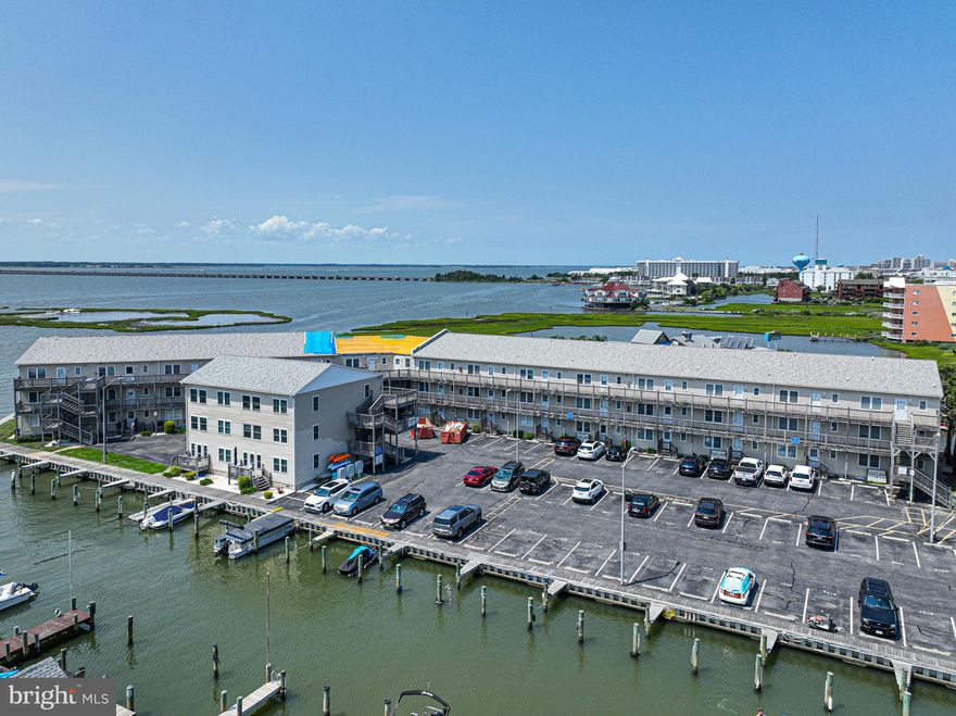 Prime Waterfront Location with the Best views in Midtown OC.    Let your new  home or vacation oasis be this beautiful 2 bedroom 2 bathroom condo that is fully furnished and move in ready.  Enjoy watching the panoramic views of the bay with amazing sunsets from this 3rd floor unit.    Walk to your assigned boat slip #33 with tax id 10734711  to jump on your boat or jet skis for a day on the water.  Then off to some of the best restaurants and nightlife locations Ocean City has to offer such was Mackys,  Fagers Island, and Seacrets.  Schedule your private showing today and start enjoying the beach life in this stunning unit..