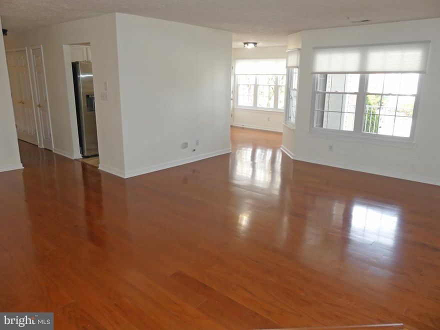 Super Clean & Gorgeous! 2nd flr-steps. Hwd flrs in liv/dine/breakfast rm & hallway. Entire unit freshly painted. New SS Frig w/ice/h2o disp, flat top stove, dishwasher & b-in micro. Updated lighting, c-tile flrs, new carpet, new honeycomb blinds, 5 ceil/fan lites, laundry rm w/updated washer & dryer, lg balcony w/storage closet. Huge primary bedrm w/w-in closet & updated bath. Heat Pump/A-C 2020. Swim Pool in summer. Assigned Parking #53, directly in front of unit. Beautifully maint.