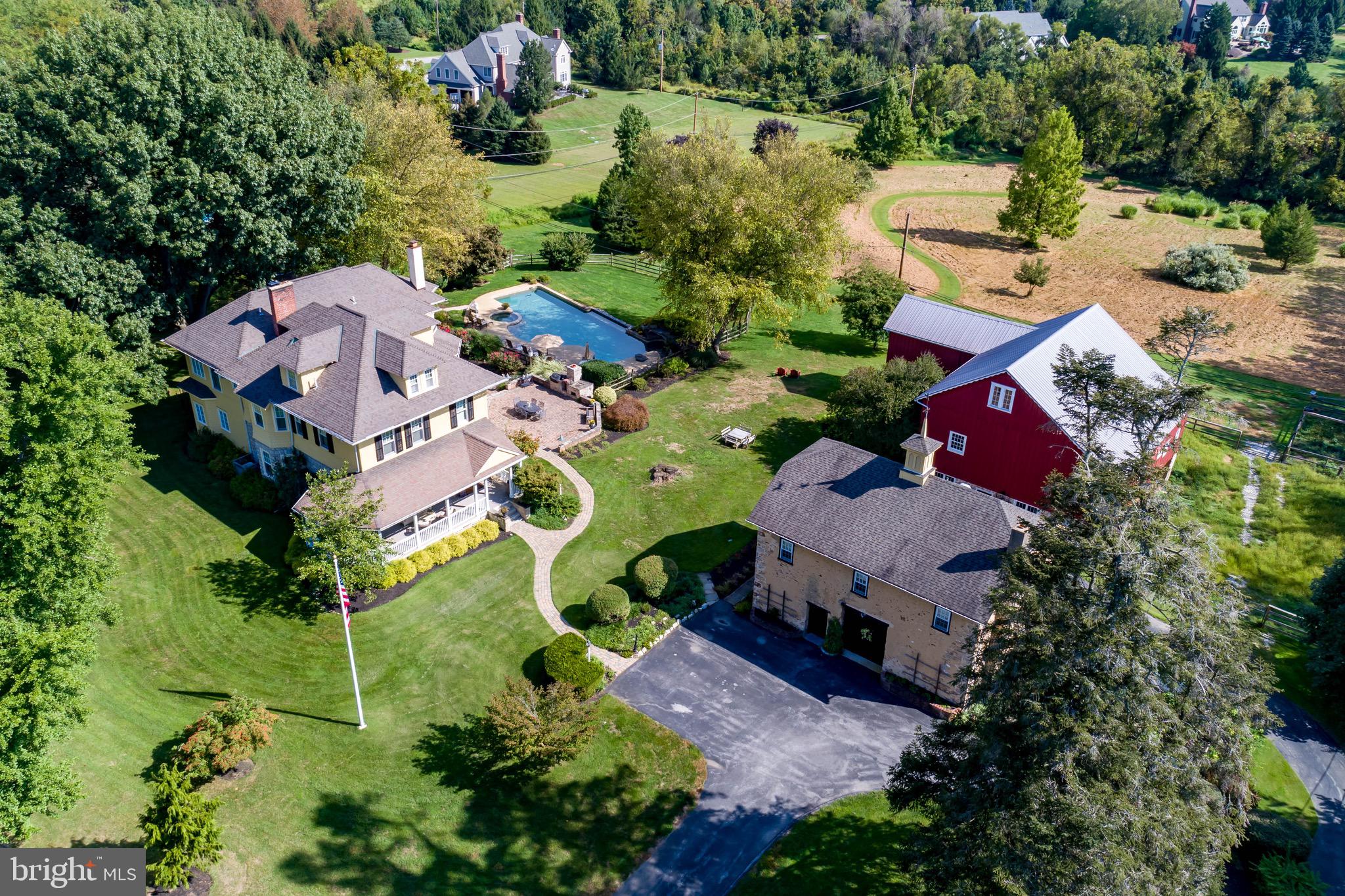 Enjoy country living at its best, with easy access to everything in this spectacular estate property located on 4.3 picturesque acres in top ranked TE Schools, just minutes to Paoli Amtrak/Septa train. The main house of this truly special property is a Victorian Farmhouse with 6 bedrooms, 3 full and 2 half baths, plus there is a gorgeous 2 story bank barn with 4 horse stalls, goat pen and chicken coop; and a carriage house with a separately zoned 2BR/1BA apartment, plus a gorgeous resort-like pool and spa amidst bucolic grounds. Plenty of room to home school, work from home and spread out during quarantine! Some of the special features are wide planked wood floors, gorgeous 3 story staircase, beautifully detailed woodwork and built-ins, a large wrap around porch, pocket doors, numerous built-ins, numerous bay windows with window seats, a wine cellar, 4 fireplaces, new septic system and an irrigation system. This historic home was doubled in size and completely renovated in 1998 with the highest quality materials and craftsmanship and has all the modern features today's buyers are looking for while keeping the character of old. It also has a fun history as a Speakeasy during Prohibition! With the gorgeous pool, amazing views, spacious home and property, I can not think of a better place to work from home or quarantine! You truly will never want to leave!! Carriage house apartment is perfect for in laws, au pair or caretaker cottage! The main floor of the house features an expansive gourmet chef's kitchen that is adjacent to a stunning family room w/ FP, built-ins and window seat. The beautiful entry hall with gorgeous staircase, formal living and dining rooms with beautiful moldings, a breakfast room/play room and 2 powder rooms complete the main floor. The second floor features a stunning master suite with fireplace, luxury bath and two balconies overlooking the estate and an adjacent office. There are 3 additional bedrooms, a laundry and a nicely renovated hall bath on this floor. The 3rd floor has 2 bedrooms and a nice hall bath with claw foot tub/shower. The large finished basement is great for entertaining with a full bar, wine cellar, workout room and rec room. Enjoy views of the property from the wrap around front porch and numerous balconies. The barn is perfect for equestrian/farm use plus it has a gorgeous open space on the 2nd floor providing a great space for entertaining. This property, which backs to Lorimer Preserve (great walking trails!) keeping it forever private, is just minutes to trains, shopping and highways which allows for peaceful country living with easy access to everything!! The best of both worlds! With the gorgeous pool, amazing views, spacious home, barn, vegetable garden, chicken coup, goats pen and property, I can't think of a better place to work from home or quarantine! You may have admired this house for years, and now you can make it your own! Do not miss this great opportunity! Please click on the icon to enjoy the virtual tour!