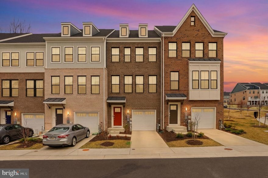 Welcome to 11802 Summer Woods Place, a beautifully designed townhome located in the desirable Marriottsville area of Howard County. Built in 2024, this modern home offers the perfect blend of style, comfort, and convenience in one of the region’s most sought-after communities. Step inside to discover a bright, open-concept layout designed for both everyday living and entertaining. The spacious main level features abundant natural light and a contemporary kitchen with modern finishes, ample cabinetry, and an impressive 13.5-foot island that serves as the centerpiece of the space—perfect for cooking, gathering, and entertaining. The kitchen flows seamlessly into the dining and living areas, creating an inviting atmosphere for hosting guests or enjoying quiet evenings at home. Upstairs, you’ll find generously sized bedrooms, including a serene primary suite designed for relaxation and privacy. The lower level offers a versatile finished space that can easily be used as a fourth bedroom, home office, gym, or additional living area. Conveniently located directly next to this space is a full bathroom, making the lower level ideal for guests, extended family, or a private workspace. Beyond the home itself, the location offers exceptional lifestyle convenience. Residents enjoy easy access to nearby shopping, dining, and everyday essentials at Turf Valley Towne Square. Outdoor enthusiasts and golf lovers will appreciate being just minutes from Waverly Woods Golf Club and the luxurious Turf Valley Resort, which offers golf, dining, spa services, and resort-style pool amenities. Commuters will love the home’s convenient access to major routes, including Interstate 70, Maryland Route 29, and Maryland Route 32, making travel to Columbia, Baltimore, and Washington, D.C., both quick and convenient. With modern construction, a thoughtfully designed layout, flexible living spaces, and an unbeatable location close to recreation, dining, and major commuter routes, 11802 Summer Woods Place offers the perfect place to call home.