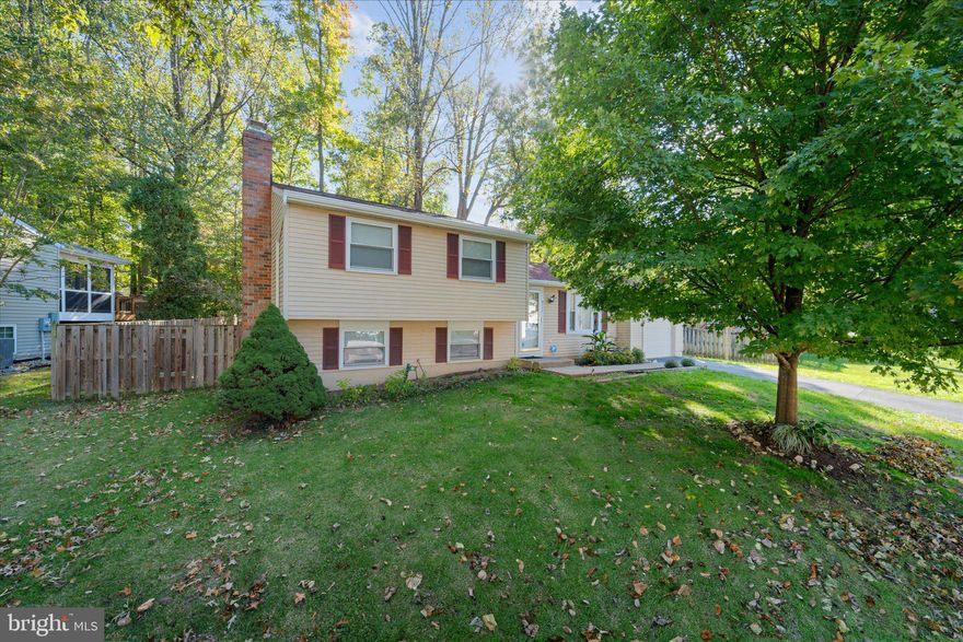 This charming single-family residence on a culdesac is a true gem, offering an incredible opportunity at an unbeatable price! Spanning almost 1300 finished sq ft, this home also features a fully fenced backyard, perfect for privacy and outdoor enjoyment. The oversized one-car garage comes equipped with a workbench, making it ideal for DIY enthusiasts. Step inside to discover a kitchen that will inspire your culinary adventures. With three spacious bedrooms and two full bathrooms, this home is designed for comfort and convenience. Enjoy cozy evenings in the basement rec room, complete with a fireplace. The ample storage/laundry area has built-in shelving. Recent updates include a newer roof, a sliding door leading to the backyard, and updated water valves and electrical systems. The driveway was recently paved in 2021. Located just a short drive to VRE and to the highly sought-after LBSS and bus line, this home is perfectly situated for your lifestyle.