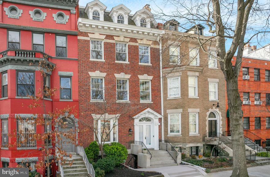 Welcome to 1852 Wyoming Ave, NW, a meticulously renovated Federal-style townhouse nestled in the esteemed Kalorama neighborhood. This distinguished residence has been thoughtfully updated to offer modern luxury while preserving its historic charm.

Enter into a world of refined living with a new gourmet kitchen featuring top-of-the-line Miele appliances and a spacious Calacatta Covelano marble island with waterfall edges, ideal for both casual dining and entertaining guests. Solid wood cabinets, handmade by Cabico, include ample storage and frame the inviting space with views of the private garden and back patio.

Significant care and attention to detail have been taken to preserve and honor the historic details throughout the home, such as the reclaimed Heart of Pine wood flooring in the new kitchen. The stately solid oak pocket doors have been restored, flanking the dining and kitchen spaces, while period-perfect chandeliers illuminate rooms throughout the home.

The main level boasts multiple gracious living and dining areas, adorned with time-honored fireplaces and built-in storage pieces. Upstairs, four bedrooms and a large light-filled family room provide ample space for relaxation and privacy. A top floor owners suite offers a private retreat and a flexible floor plan filled with natural light. Indulge in luxury in the second-floor bathroom, newly adorned with exquisite Carrara Marble tile and vanity complemented by sophisticated Nuvolette wallpaper.

Multiple balconies offer tranquil views of the Washington Monument, while a lush garden and detached 2-car garage with a rooftop deck provide additional spaces for leisure and entertainment.

The lower level includes a separate two-bedroom, one-and-a-half-bathroom apartment with new stainless steel appliances and a Certificate of Occupancy.

This home offers the best of both worlds—the peace and tranquility of a residential neighborhood, combined with the convenience of nearby dining, shopping, and Metro stations.