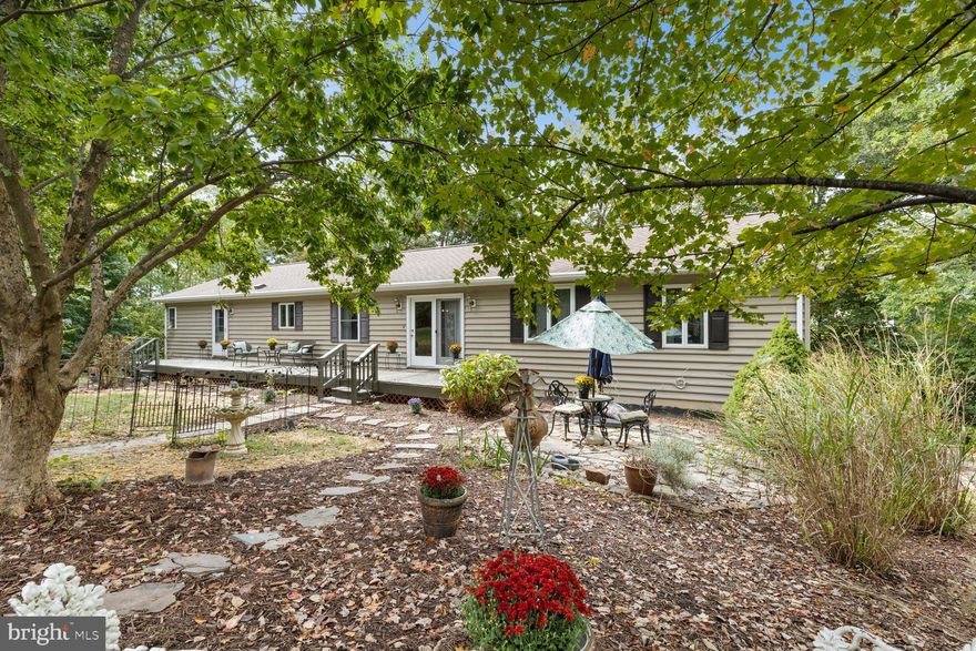 PRICE IMPROVEMENT!!!
Opportunity knocks for YOU to have your dream home—where space, elegance, and functionality come together in perfect harmony. Nestled on over 3 acres of serene, wooded land, this sprawling ranch-style residence offers more than 4,000 square feet of beautifully designed living space, thoughtfully enhanced by a finished basement converted into a private in-law suite/apartment.
With 3 FULL kitchens, this home is a rare gem for multigenerational living, entertaining in style, an in-law suite, flex space, or rental income. The gourmet kitchen is a true chef’s dream, boasting a premium KUCHT 6-burner gas stove, stainless steel appliances, a farmhouse sink, and luxurious marble countertops—all framed by custom cabinetry and bathed in natural light.
This home features 5 full bathrooms and 2 luxurious master suites on the main floor, each offering spa-like tranquility. One suite includes a massive 150-gallon soaking spa tub, perfect for unwinding after a long day, along with  walk-in closets for all your storage needs.
The open floor plan showcases rich, color-saturated wall finishes, blending modern elegance with cozy warmth—ideal for both everyday living and entertaining. Large windows provide abundant natural light and seamless views of the stunning outdoor surroundings.
Step outside and enjoy beautifully landscaped flower garden spaces, offering a peaceful retreat and seasonal color. Two versatile outbuildings provide ample storage or workshop space, giving you endless possibilities.
An UNBELIVEABLE VALUE for this move-in ready home with exceptional layout flexibility and income potential.  This home has rental potential, or an in-law suite, man-cave area, office space area's, this home can suit anyone's desires. A rare opportunity to own a high-functioning home in a peaceful, private setting. This home was built in 2004 by a local builder.
 MOTIVATED SELLER!!! Schedule your private showing today and experience everything this exceptional property has to offer! Come see what this home can OFFER YOU!!!