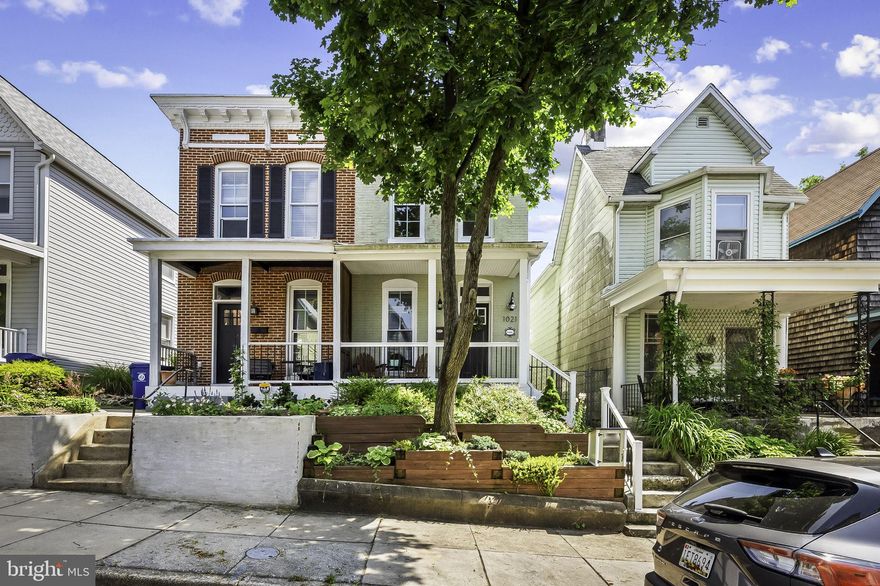 This Hampden home has it all. Located on one of the best blocks in Hampden, this house has great features from front to back. Experience the quiet life on this tree lined, one way street. You will even have your very own "Little Library ".This home as a FULL RENOVATION just prior to the sellers ownership. Impeccable maintenance has been completed since rehab. The easy to maintain terraced front yard leads to a charming front porch. Once inside this well appointed EOG home will impress you with a blend of contemporary and classic finishes. The open floor plan has great quality hardwood flooring leading to a beautiful wide kitchen which includes a large 4 seat island. High quality cabinets, granite counters, and stainless steel appliances compliment the luxury aesthetic.  First level has many west facing windows which include custom blinds. First floor has convenient  powder room located near rear door. Rear of home has a great south facing 2 story deck leading to yard. Yard had 1 car parking pad and green space. The basement has high ceilings  and is finished with a contemporary tile  floor. There is additional storage in basement too. The 2nd level has 2 large bedrooms and 2 large bathrooms. There is a laundry room with a side by side washer dryer in the hall.  A centrally located skylight allows plenty of light to enter at any time of day. Rear bedroom is large with spacious closets and rear deck access. The front bedroom is a large primary bedroom with ensuite bathroom featuring a large vanity and tile shower with new glass doors.  All closets have built in custom organization systems. This beautiful brick home is sure to please. The Avenue and new restaurants are just 2 blocks away and 2 large community parks are each less than .25 miles from house.