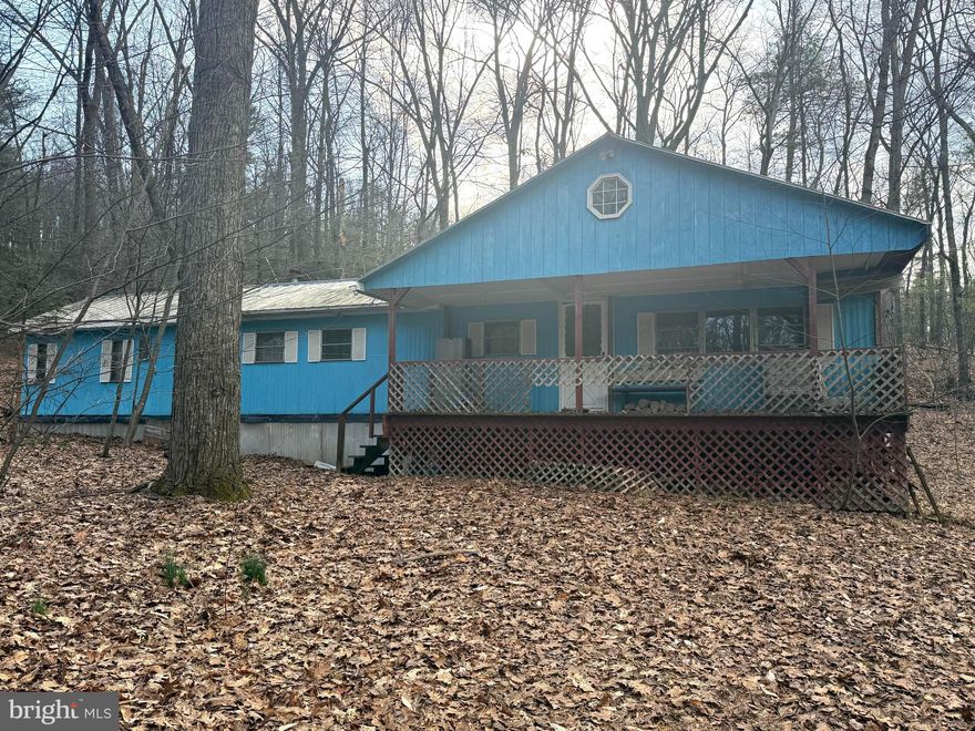 Tucked away on 2.11 wooded acres in scenic Perry County, 228 Pine Brook Drive in Newport, PA offers a rare opportunity to create your own private retreat surrounded by nature. Set among mature trees with abundant wildlife, this property is ideal for those seeking peace, privacy, and the beauty of the outdoors.

The existing home—a mobile home with an addition on a foundation—offers a starting point for your vision but requires a full renovation. Inside, you’ll find 3 bedrooms, 1 bathroom, and a spacious great room featuring vaulted ceilings, a cozy wood stove, and a loft area that adds character and potential. With the right imagination and updates, this structure could be transformed into a charming mountain getaway or weekend escape.

Whether you’re looking to renovate, rebuild, or simply enjoy the land as-is, the possibilities here are endless. Embrace the opportunity to design your dream home in a serene, natural setting while still being within reach of nearby conveniences.

Bring your ideas and make this hidden gem your own!