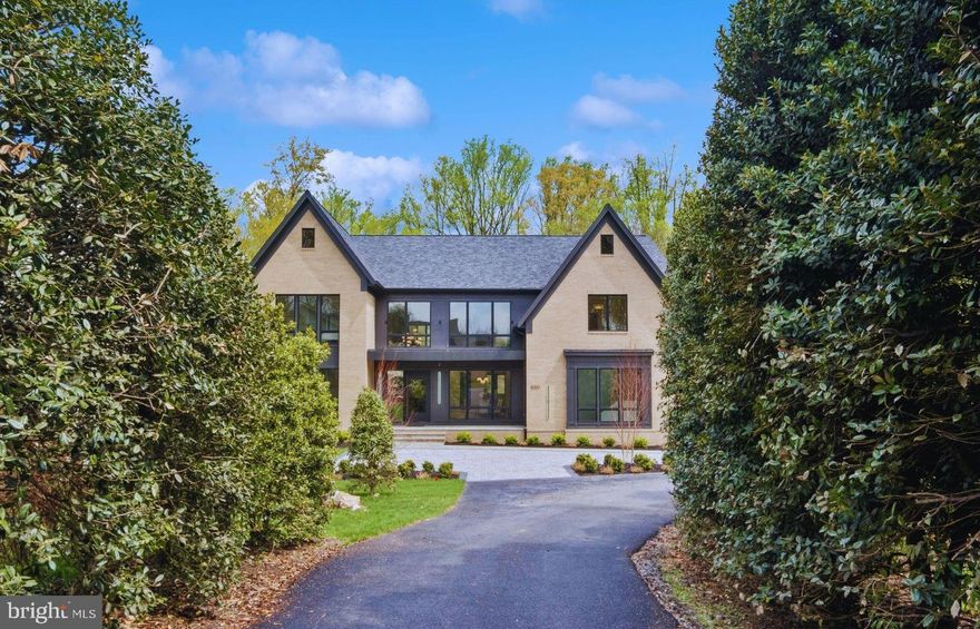 New Construction, JUST COMPLETED, Staged & Ready for Immediate Delivery with a New Circular Driveway Added! Welcome to, "Pond View at Weller, " an exquisite custom-built home nestled on 0.63 acres in the serene cul-de-sac of the Dogwoods Community. Upon entry, the contemporary grandeur of a 20-foot ceiling and an elegant LED lit floating glass staircase welcomes you, setting the stage for the luxury that unfolds throughout this spacious three-story manor. This architecturally stunning home boasts over 9,000 square feet of sophisticated living space, featuring six Ensuite bedrooms, seven well-appointed full bathrooms, and a Italian marble chic powder room. Convenience is personified with a private elevator catering to all levels. The heart of the home is the gourmet kitchen, graced with top-tier Viking appliances and sleek Italian design cabinetry, seamlessly flowing into a bright morning room with a charming two-sided fireplace. Adjacent is the all-season patio, complete with a spacious deck offering idyllic pond views and an expansive shared 12-acre common area green space — perfect for alfresco dining and year-round entertainment. Entertain in style in the dining room, under the ambience of a multi-level drop ceiling with delicate accent lighting, or in the sumptuous formal living room that doubles as a study. Elevating your entertainment possibilities, the butler's pantry serves as a gateway to the formal dining area and boasts a 75+ bottle built-in wine cellar — a sommelier's dream. The main floor is completed with a guest suite, built out mudroom, and laundry for added convenience. On the second level, indulge in the luxurious owner's suite, complete with a coffee bar, beverage fridge, cozy sitting area divided by a warm gas fireplace, and step out onto the private balcony to soak in the tranquility. The master bath has been designed using the finest exotic Italian marble, incorporated in the shower with bench, the heated floors and counter tops for dual floating vanities. A stunning oversized tub, and a sleek glass shower  enclosure — all adjoining an expansive his and hers 9’ x 15’ custom fitted walk-in closets. The upper level continues to impress with a large loft, providing an additional area for relaxation and entertainment, along with a convenient wet bar, beverage cooler and access to the outdoor terrace. In addition, there are three additional bedrooms with en-suite baths, featuring floating cabinets and quartz vanity tops. For added practicality, laundry facilities are available on both upper and main levels. The lower level is an entertainer's paradise with a sophisticated wet bar featuring a full size wine refrigerator, a sleek waterfall granite bar, exercise room, guest bedroom, theater room, and ample storage space. This level also features a set of three French doors opening to a picturesque stone patio. Equipped with wiring for audio and security, the home ensures contemporary ease of living, along with an attached three-car garage for your prized vehicles. "Pond View at Weller" promises a lifestyle of unparalleled comfort and elegance. Located conveniently close to Tysons, McLean, and Spring Hill Rec Center, with sought after schools such as Spring Hill ES, Cooper MS, and Langley HS within reach.  "Pond View at Weller" is not just a residence; it's a testament to uncompromising quality, where only the finest materials have been curated to craft each detail of this magnificent home. Contact the listing agent for a private showing.