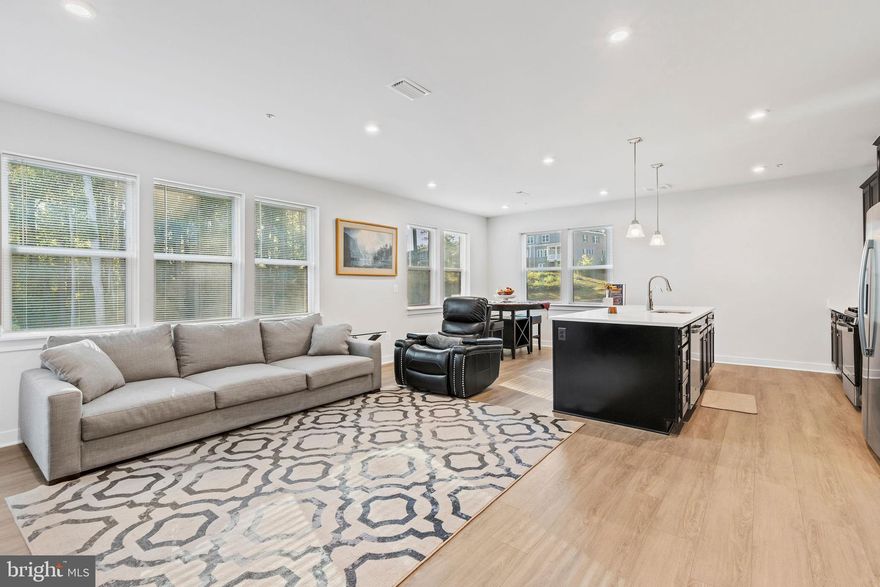 Rare garden level corner condo in Turf Valley offering both privacy and convenience This move in ready home features direct walk-out access to a spacious private patio that backs to a peaceful wooded area, creating a quiet outdoor setting that’s hard to find in condominium living.

Enjoy ground level entry with no elevators, stairs, or long interior hallways. With only three residences on this level, the layout offers added separation and easy everyday access and is among the larger floor plans available in the community.

Inside, the fully updated interior showcases an open concept floor plan ideal for entertaining and flexible living. Upgrades include luxury vinyl plank flooring, recessed lighting, and a modern kitchen with an oversized island, stainless steel appliances, gas cooking, soft-close cabinetry, and pantry storage.

The spacious primary suite includes dual vanities, a walk-in shower, and a large walk-in closet. Smart-home features include automated lighting controls, concealed media wiring, digital keyless patio entry, and integrated technology enhancements.

Energy-efficient construction helps maintain comfortable indoor temperatures year-round.

Conveniently located near Turf Valley Towne Square shopping, golf courses, restaurants, and major 
commuter routes with easy access to Columbia, Ellicott City, and surrounding areas.