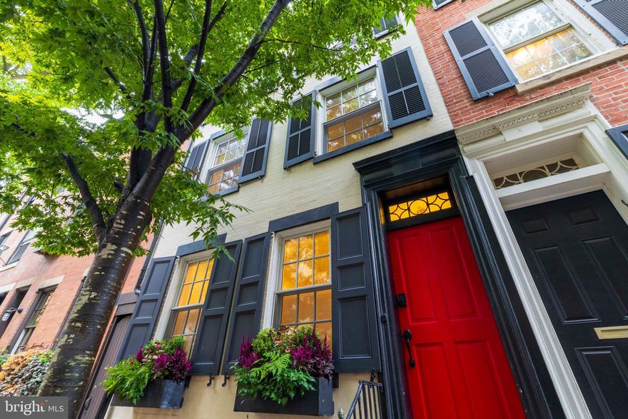 Smedley Street Stunner!  Absolutely lovely 3 bed/2.5 bath home on one of the most desirable, tree-lined blocks in Rittenhouse Square.  The charm of the home is evident right away, as the front exterior features a custom aluminum tree surround, no-rot composite window boxes and loads of curb appeal.  The updated entry vestibule is the perfect spot to hang your coat and wipe your feet off before stepping into the sleek, modern living/dining room with a gorgeous Akari light fixture and updated LED ceiling lights throughout.  Local interiors firm Fisher Grey designed the custom pantry/closet/coffee bar with quartz counter and backsplash in the updated kitchen that also features a new island, new drawer microwave, new dishwasher, vintage Danish pendant lighting and a radiator shroud with a quartz top.  A redecorated powder room is conveniently located on this level as well.  The back garden is a delightful oasis with lovely cedar privacy lattice and gate, and native plantings. Permeable pavers have been installed under the Rain Check program sponsored by the Pennsylvania Horticultural Society and the Philadelphia Water Department, and a downspout planter reflecting the Rain Check program's design also has been installed.  Heading up the stairs to the 2nd floor, there is a hand made, removable cherry wood baluster insert and a new striped wool runner.  The 2nd floor family room/library is truly a sight to behold. Custom Fisher Grey designed cherry bookshelves and audio cabinet were expertly created and installed by the Philadelphia Woodworking Company and are the ultimate expression of form, function and style.  The wood burning fireplace with a refinished mantle makes this a cozy yet spacious space that is perfect for curling up with a good book or listening to some vinyl.  The primary suite is located on this level as well and offers plenty of storage between the built-in wardrobes and closet with Elfa storage system.  The renovated en suite bathroom includes a new vanity, new tile, Kohler and Toto fixtures and a Runtal towel warmer/radiator.  The third floor offers another full bathroom as well as two spacious bedrooms. No detail has gone unnoticed in this home - from period correct Greek Revival moldings and trim to updated light fixtures.  This one truly checks all of the boxes - abundant natural light, central air, enough beds/baths, multiple living spaces, a gorgeous patio and a WalkScore of 99!  This is truly the ultimate in city living.