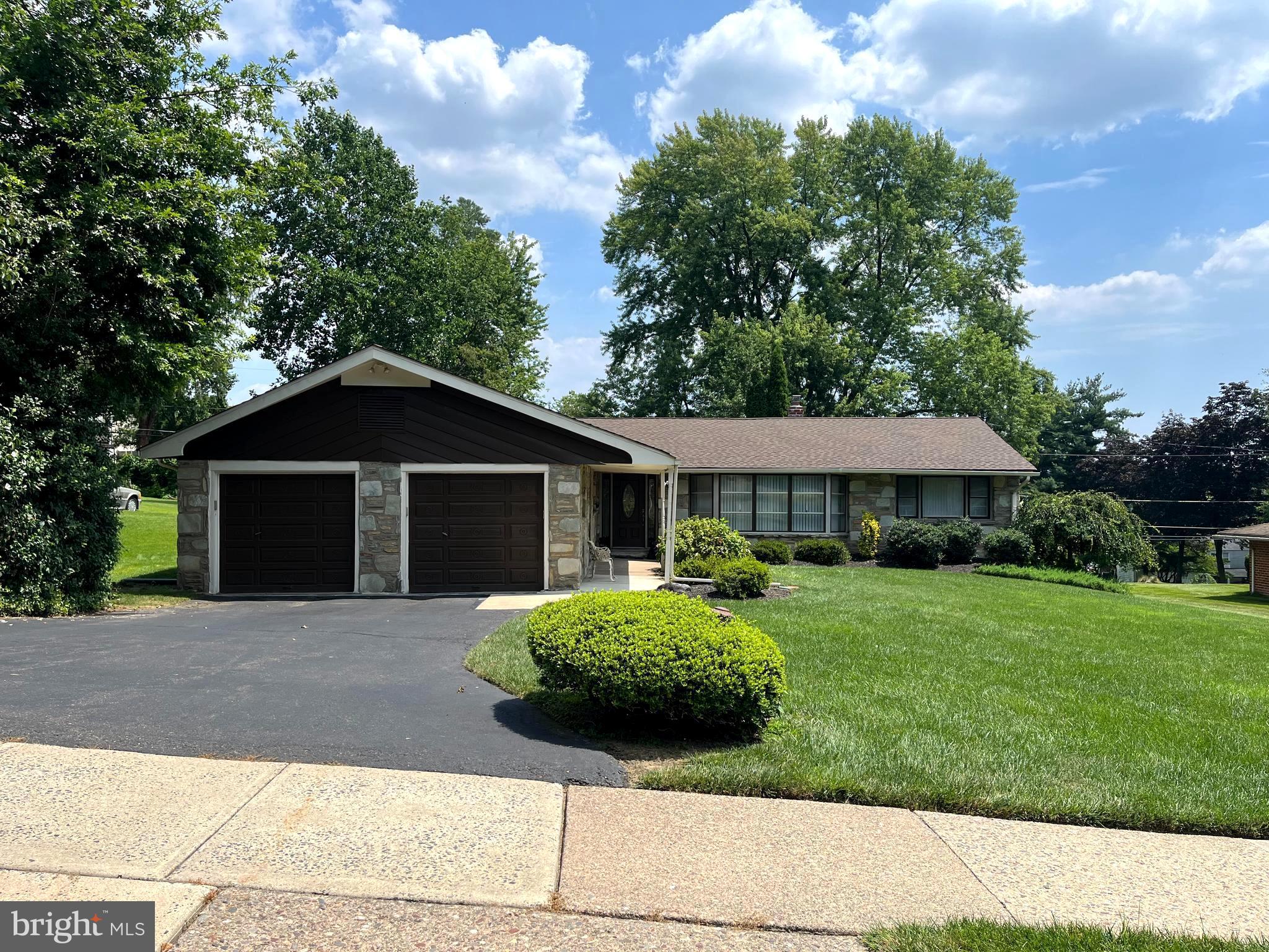 WELCOME TO LOVELY AUDUBON DRIVE IN SOUGHT-AFTER UPPER DUBLIN TOWNSHIP! SHOWINGS BEGIN AUGUST 25. To Left of this Stone/Brick Rancher is Wide Private Driveway and 2-Car Garage -there's a Brand-New Roof in 2024! The Covered Front Entry Features a Decorative Steel Door, Large Foyer with Handy Double Coat Closet, Stained-Glass Divider between Sunken Living Room w/w/w Carpet, Carpeted Formal Dining Room, Vertical Blinds, Roomy Eat-in-Kitchen w/Granite Counter Tops, Newer Flooring, New Bosch D/W, Tiled Backsplash, Lots of Cabinets, G/D, Trash Compactor, Microwave, Electric Cooking. A Convenient 1/2 Bath w/Vanity Sink is Located Opposite the 1st Floor Laundry Room w/Wood Floor, Washer, Electric Dryer, Storage Cabinet above - the Spacious Family Room Provides a Great Place to Relax especially with the Vented Gas Stove/ Fireplace , Built-in A/C - New Ceiling Fan - there's a Decorative Stone Electric Fireplace w/Mantle; Exit to Airy Rear Covered Patio w/Retaining Wall- The Full Hall Bath is Bright w/New Double Sinks, Re-done Vanities, Tile Floor - 2 Lovely Wall Cabinets, Tub, Hall Linen Closet w/Louver Door; the 1st of the 4 Bedrooms has Ceiling Fan, Lighted Double Closet, w/w Carpet; the Whole -house Fan is on Timer, (switch on wall);2nd Bedroom has w/w carpet, closet - The Large Main Bedroom Provides Wall to Wall Closet Space w/Louver Doors; 2 Windows, one w/A/C Unit, Full Master Bath Features Replaced Vanity Sink, Tiled Floor and New Tile in Oversized Stall Shower; 4th Bedroom has Lighted Double Closet, w/w Carpet Radiant Heat in Main Bedroom, Hall Bathroom & other Bedrooms - Security System - A full walk-out basement provides storage and the Weil-McClain Gas Hot Water Heater, Gas Hot Water, 200 Amp Electric 2 sump pumps, French Drain; Water Softener. Peaceful Rear Yard, Super- Desirable School District , Minutes from Rt. 309, Turnpike, Golf, Restaurants, Shopping, Parks and More! See it Today!