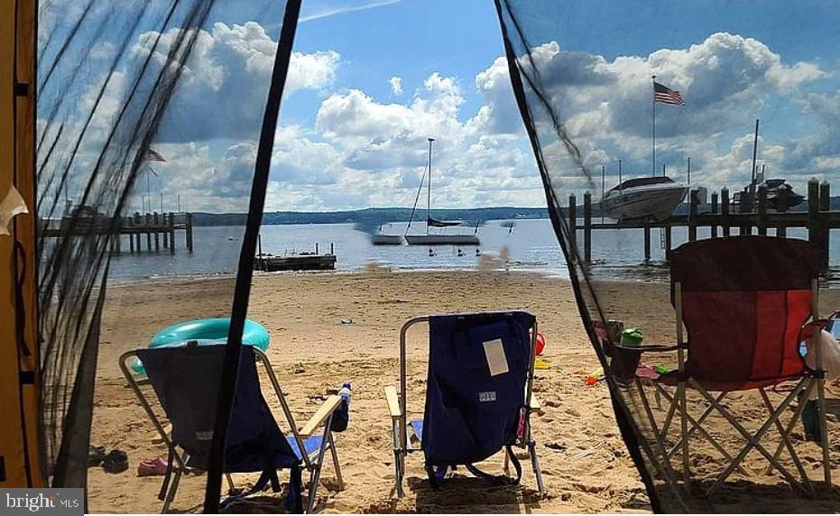 This is a very rare fresh-water beach lot at the top of the Chesapeake Bay. Its highlight is exactly that, a beautiful sandy beach! Most people must boat to find a sandy beach that is the front yard for this lot! Play in sandy shallow water for little ones! Or bring in your boat or jet ski to the beach to load and go! Two moorings in place now. The location of this property also results in occasional flooding and requires raised construction. Plan your pier for deeper water access if desired. Boat to Annapolis! Utility access available at street.
