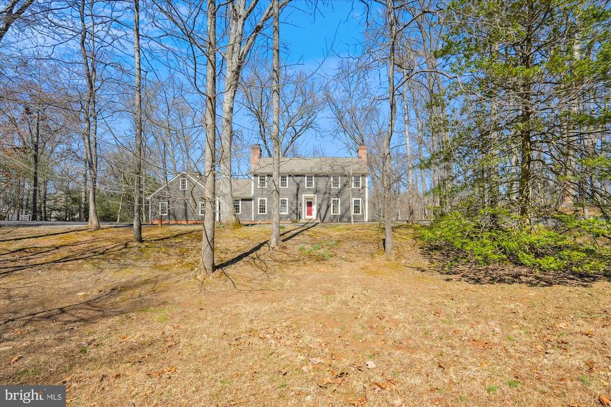 Stunning New England Style  4 BR, 3.5 Bath Colonial with finished walkout basement on  2.9 Wooded Acres backing to a Beautiful Stream! MANY IMPROVEMENTS  in recent years including: Hardie Plank Siding, Timberline Architectural  Shingle Roof, Gutters, Soffit, Paved Circular Driveway, Garage Doors and Stone walkway to front door. The Interior  Updates include:  freshly painted throughout all 3 levels, refinished  hardwood floors on the main & upper level, Refreshed Powder Room & Hall Bath  on Upper Level,  Brand NEW Frigidaire Propane Gas Cooktop in Kitchen,  Double Wall Ovens and some light fixtures and ceiling fan in Family Room. The back yard  has a gate and easy access to the woods  for the buyer looking for privacy and the  enjoyment  of a meandering stream! There are  FOUR wood burning Fireplaces, 3 on the main level and 1 in the lower level and detailed moldings throughout.   Being Sold in  AS IS Condition and priced appropriately, however  the house is in BEAUTIFUL  MOVE-IN READY CONDITION! Privacy, Serenity & Nature at it's Best!