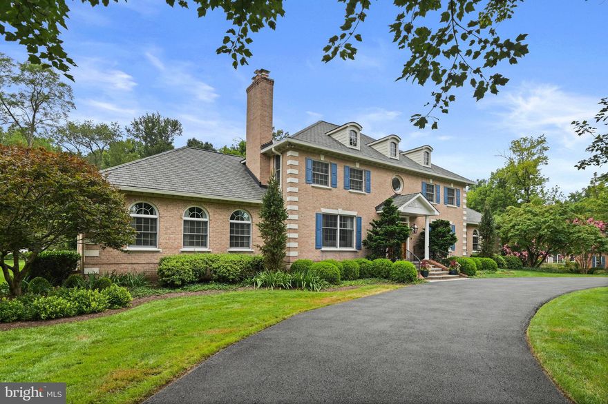 Classic Brick Colonial with Exceptional Outdoor Living in Great Falls!***** This is the home you've been waiting for!***** Featuring a main-level primary suite and set on approximately two lush acres on a quiet cul-de-sac, this timeless brick colonial blends refined living with extraordinary outdoor spaces. The home has been immaculately maintained, thoughtfully enhanced with professionally designed interiors and quality finishes. A spectacular screened porch anchors the rear of the home, leading to stone patios, custom decking, and extensive hardscaping. Entertain and relax year-round with a beautifully landscaped firepit area, private stone walkway, and outdoor hot tub tucked into the serene setting. Mature trees frame the property, creating a natural backdrop of privacy and beauty. ****Highlights include*****Main-level primary suite and spacious secondary bedrooms*****Custom built-in cabinetry throughout*****Professionally decorated with designer wall coverings, custom window treatments, carpets and light fixtures*****Recently added screened porch for seamless indoor-outdoor living with built-in grill*****Outdoor hot tub and private fire pit with stone walkway*****Expansive patios and decks surrounded by lush landscaping*****Large circular drive with ample guest parking*****Whole house generator*****Tankless water heater*****Electric car charging station*****Custom garage storage system and so much more. Situated in the sought-after Langley HS pyramid of Fairfax County Public Schools, this home is convenient to shopping, parks and bike trails. This is a rare opportunity to enjoy classic architecture, an exceptional Great Falls location, and a home designed for both everyday comfort and unforgettable gatherings.