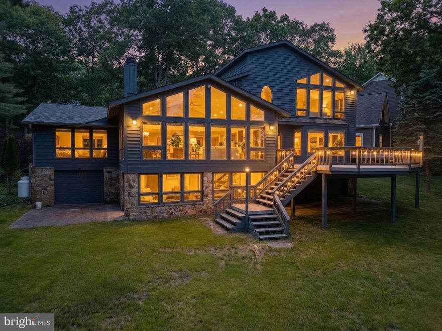 One of Deep Creek Lake's most premium settings greets you on the point of this remarkable 4 bedroom, 4 bathroom lakefront home with 231' of level lakefront with eastern exposure, offering amazing sunrises looking down a long stretch of the lake toward Turkeyneck! 1 oversize attached garage space offers plenty of space for your vehicles on the street side and 2 attached garage spaces provide room for your lake toys on the lower level. An expansive deck provides plenty of room for outdoor entertaining, and multiple living spaces inside provide plenty of room for guests to enjoy their time at the lake. The Type A dock sits in deep water, great for swimming and enjoyment. The home sites on a private lane and is the next to last home on the street. The location is just minutes from all of the area's most desirable restaurants, golf courses and Wisp Ski Resort! Buydown has been purchased and conveys.  Looking for an opportunity to own a premium waterfront home on one of the best settings at the lake? Call today to schedule a private tour!