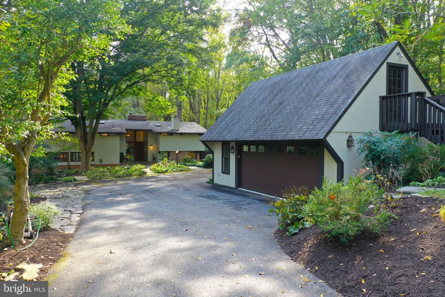 Welcome to this magnificent home in the heart of Potomac with the C&O Canal just steps away through your own backyard. Situated on a 2.5 acre private wooded lot with tranquil surroundings and scenic views from every room. The moment you drive up the driveway, you instantly feel as if you are in your own private retreat. Exquisitely landscaped grounds and gardens, mature trees, charming decks and patios, a beautiful swimming pool, a stone patio with a fire-pit, and a scenic preserve of grounds and foliage that provides the ultimate serenity and privacy. Custom-built by Deck House with its signature decking ceilings and exposed post and beam structure to allow the great walls of glass to naturally welcome the outdoors in. Completely renovated top to bottom with 4 bedrooms, 3 full baths, beautiful solid oak flooring and exquisite detail and materials throughout. The main floor offers a two-story foyer and a two-story solarium sunroom with wooded views and glass doors leading to the wrap around deck. The gourmet kitchen has solid walnut wood custom cabinetry, upgraded appliances, a large center island and a beautiful eat-in dining area overlooking the grounds. Off of the kitchen is a large butlers pantry and a formal dining room that could also be used as a private study. The main level great room is perfect for entertaining with views of the patio and pool, and a handsome wood burning fireplace. There is also a renovated full bathroom located on the main level. Upstairs you will find 4 bedrooms, 2 of which have interior balconies overlooking the solarium, and 2 renovated full bathroom. The lower level offers a recreation room with new carpeting and built-in shelving, a wine cellar and glass doors leading to the back patio. There is ample storage and a large laundry room on the lower levels as well. New Geothermal System (2023), New Roof and Windows (2011), Propane gas line hookup, New Exterior French Drain (2019), New Water Softener System (2022), New Pool Filter System (2020).  Energy efficient home with passive solar heating in solarium, wood burning stove and added insulation. This home is complete with a two-car detached garage with an upper level loft and a private path leading directly to Swains Lock C&O Canal National Park where you can hike, bike, run, kayak or cross-country ski right from your own backyard. Do not miss this exceptional property!