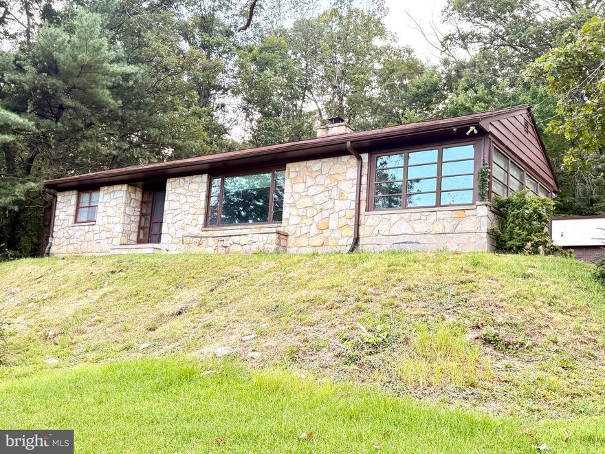 *****MOTIVATED SELLER*****
One-Level Living Surrounded by Nature — Within City Limits!
Lots of potential with this charming stone rancher, it offers the perfect blend of tranquility and convenience. Just minutes from downtown Cumberland, you’ll enjoy the serenity of nature without sacrificing accessibility.
This home features 2 bedrooms and 1 full bathroom. Set back from Braddock Road, it offers ample parking and a spacious two-car garage. 
A cozy sunroom provides a relaxing space to take in beautiful mountain views.
If you're seeking a home surrounded by natural beauty—and close to everything—this is it.