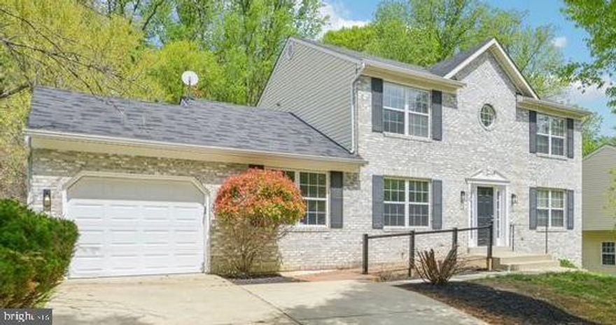 MULTIPLE OFFERS - Offers will be reviewed Friday, April 25,  5 pm. Welcome to this stunning brick colonial—beautifully updated and move-in ready! The open-concept chef’s kitchen boasts modern white cabinetry, sleek appliances, and a central island, seamlessly flowing into the formal dining room, living room, and spacious family room.

Enjoy the flexibility of a main-level bedroom with its own ensuite bathroom—perfect for guests or a private home office. A convenient powder room is also located on the main level. Upstairs, you’ll find four generously sized bedrooms and two stylish, updated bathrooms.

Step outside to a large deck overlooking the backyard—ideal for entertaining or unwinding. The finished walk-out lower level with full bathroom and plentiful storage adds even more living space and versatility.

This home blends timeless charm with modern comfort—don’t miss your chance to make it yours!