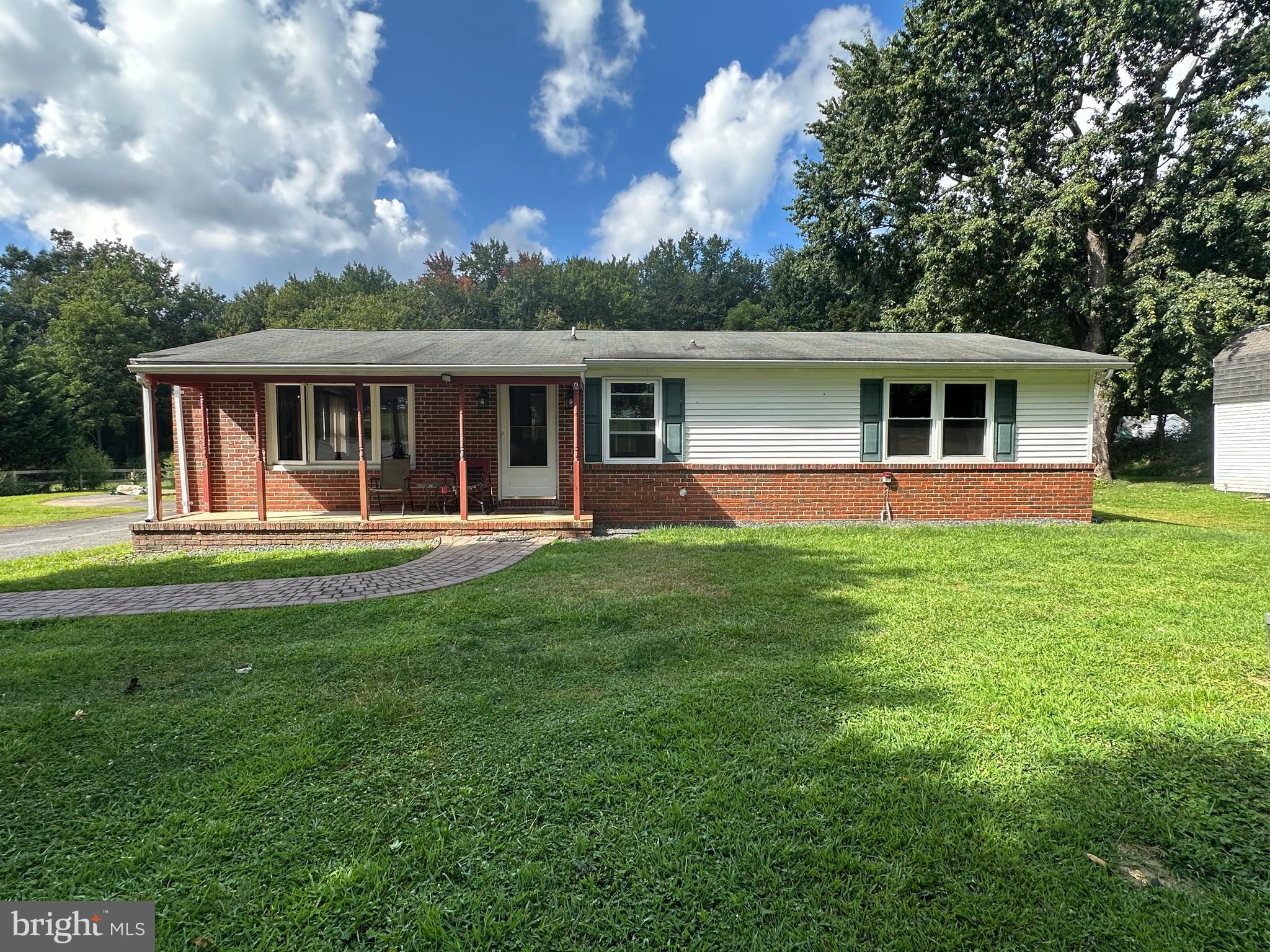 Welcome to 4368 Norrisville Rd, a peaceful, private, and well maintained rancher on 1.48 acres. One level living with wooded scenery and 3 outbuildings all with electricity to enjoy hobbies such as gardening, working on cars, woodworking, or anything you like! The home features a primary suite with gorgeous updated full bath, 2nd bedroom with closet, and large full bath down the hall. The living area which has pellet stove to keep you cozy in the winter and help with utilities wraps around to the dining and kitchen . Spacious kitchen provides plenty of cabinet space and extra water filtration system under sink. Laundry room is found just off the kitchen for easy access, extra storage, and outdoor access. The detached garage is oversized, has attic for extra storage, connected electricity, wall mounted heating and cooling unit, and building could be easily connected to water source. Crawl space was completely redone and sealed and french drain installed 2015. Water heater and extra water filtration system 2017.