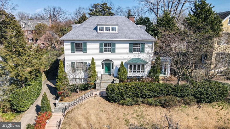 Located on a premier street in Guilford, this impressive light-filled colonial is ideal for entertaining or casual family comfort. Brand new gourmet eat-in kitchen with custom cabinetry, Subzero refrigerator, 6-burner Wolf range/stove, granite counters, and wine/coffee station w/access to private flagstone patio and fenced back yard. Architectural details throughout: beautiful moldings, wainscoting, millwork, hardwood flooring and 9 ft. ceilings. Elegant foyer is flanked by a formal dining room and spacious living room with wood burning fireplace and French doors that open to an inviting sun porch. Second level includes a primary suite, with an updated primary bath, plus 3 additional bedrooms, a newly remodeled  hall bath, a fabulous spacious laundry room with custom cabinets and a walk-in cedar closet. Third level includes two additional bedrooms, an office, and a hall bath.  Lower level includes a finished family room, full bath and storage room. Impeccably maintained. Updates include 2021 Kitchen renovation & new1st floor & lower level HVAC, Second Floor Laundry Room and Hall Bath Remodel, 2022. Hardwood Floors Refinished, 2022.  A serene setting in a beautiful neighborhood. Located within walking distance to private and public schools, restaurants, parks and Sherwood Gardens.