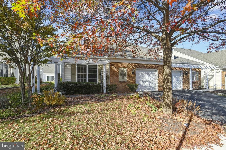 THIS END UNIT BURLINGTON MODEL IS SITUATED IN THE HIGHLY SOUGHT-AFTER 55+ COMMUNITY OF POTOMAC GREEN. AS YOU ENTER, THE FOYER WELCOMES YOU WITH HDWD FLOORS, ADORNED WITH CHAIR RAILING AND CUSTOM MOLDING FOR AN ELEGANT TOUCH. THE ML FEATURES A STUDY WITH GLASS-PANELED DOORS, OFFERING A PRIVATE SPACE FOR WORK OR RELAXATION. THE GOURMET KITCHEN BOASTS GRANITE COUNTERTOPS, A STYLISH TILE BACKSPLASH, SS APPLIANCES, AND UPGRADED CABINETRY. LOCATED OFF THE KITCHEN IS A  CUSTOM PANTRY WITH ELFA SHELVING TO ENHANCE ORGANIZATION. THE FORMAL DR OVERLOOKS THE LR, WHICH IS HIGHLIGHTED BY A VAULTED CEILING AND SOLATUBES FOR EXTRA NATURAL LIGHT. ADDITIONALLY, A GAS FIREPLACE WITH A MANTLE ADDS WARMTH AND CHARACTER TO THE LIVING AREA. DOUBLE GLASS-PANELED DOORS OPEN TO A SUNROOM EXTENSION WITH TILE FLOORS, AND A  SGD THAT LEADS OUT TO THE LANDSCAPED PAVER PATIO WITH A CHARMING PERGOLA, PROVIDING THE PERFECT SPOT FOR ENJOYING COFFEE OR AL FRESCO DINING.  THE ML ALSO INCLUDES A PRIMARY SUITE WITH A TRAY CEILING AND AN ATTACHED PRIMARY BATH. THE PRIMARY BATH FEATURES A STAND-ALONE SHOWER AND A DUAL SINK VANITY WITH A GRANITE COUNTERTOP. TO MEET YOUR STORAGE NEEDS, THE PRIMARY SUITE ALSO BOASTS AN EXPANSIVE WALK-IN CLOSET. IN ADDITION, THERE IS A CONVENIENT LAUNDRY ROOM ON THE MAIN LEVEL WITH SIDE-BY-SIDE WASHER AND DRYER, ALONG WITH CABINETRY FOR ADDED STORAGE. ANOTHER BEDROOM ON THE MAIN LEVEL OFFERS NEUTRAL CARPETING, ADDITIONALLY THERE IS A SECOND FULL BATH W/ TILE FLOORS AND A TUB/SHOWER COMBO. AS YOU ASCEND TO THE UPPER LEVEL, YOU'LL DISCOVER AN ENCLOSED LOFT AREA WITH WINDOWS, PERFECT FOR WATCHING THE BIG GAME OR PROVIDING GUESTS WITH THEIR OWN PRIVATE SPACE. THE PROPERTY ALSO FEATURES A THIRD LARGE BEDROOM WITH ACCESS TO A FULL BATH AND TWO SPACIOUS WALK-IN STORAGE AREAS. THIS HOME IS TRULY A MUST-SEE, OFFERING A COMFORTABLE AND WELL-APPOINTED LIVING SPACE WITH VARIOUS AMENITIES TO ENJOY.  SOME MAJOR UPDATES INCLUDE: REFRIGERATOR (APPROX 7 YRS OLD), HOT H2O HTR (2018), FURNACE(2019), ROOF (APPROX 3YRS OLD), DISHWASHER (APPROX 3YRS OLD) MICROWAVE (APPROX 1YR OLD)