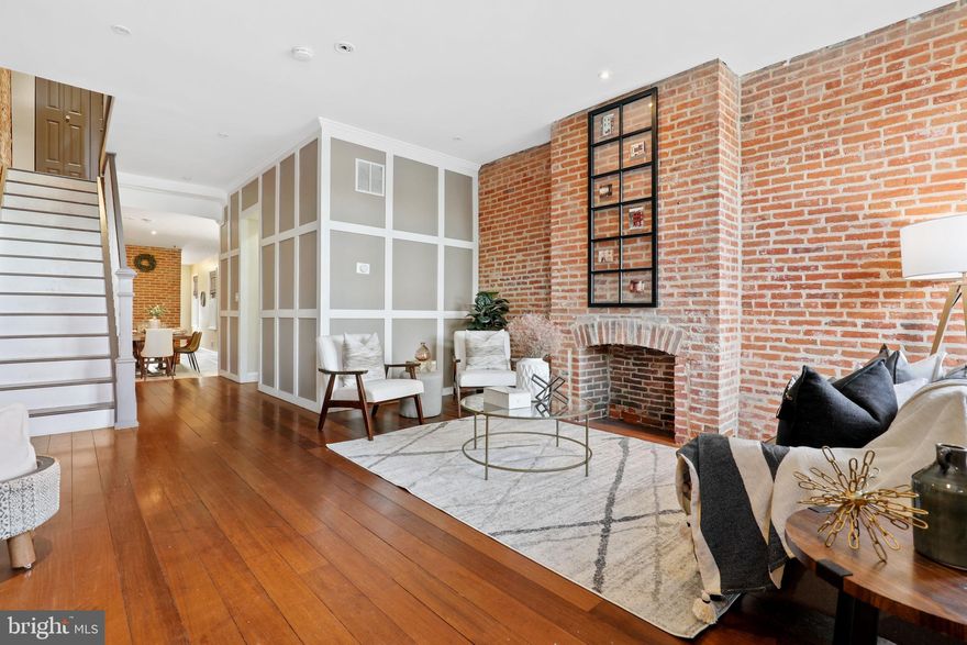 This home has beautiful high ceilings, magnificent hardwoods, and a spacious open feel throughout. The main level accommodates a dining area and living room area with a dual sided fireplace that separates the kitchen on the back of the home. The main level is an open concept that also features a powder room and back door to a 2 car parking pad. The basement is finished and very large with a high ceiling height along with a separate enclosed room big enough to hide a large amount of storage. The second level has two bedrooms with two full bathrooms and a laundry room between the bedrooms. The hallways on the second and third level feel very open and airy as the stairs are also an open concept creating a naturally lit walkway. There is a deck off of the back bedroom on the second level. The Third level features the master bedroom with a large roof deck where one can see sweeping city views. The master bathroom is very large and updated with glass and grey and white tones.