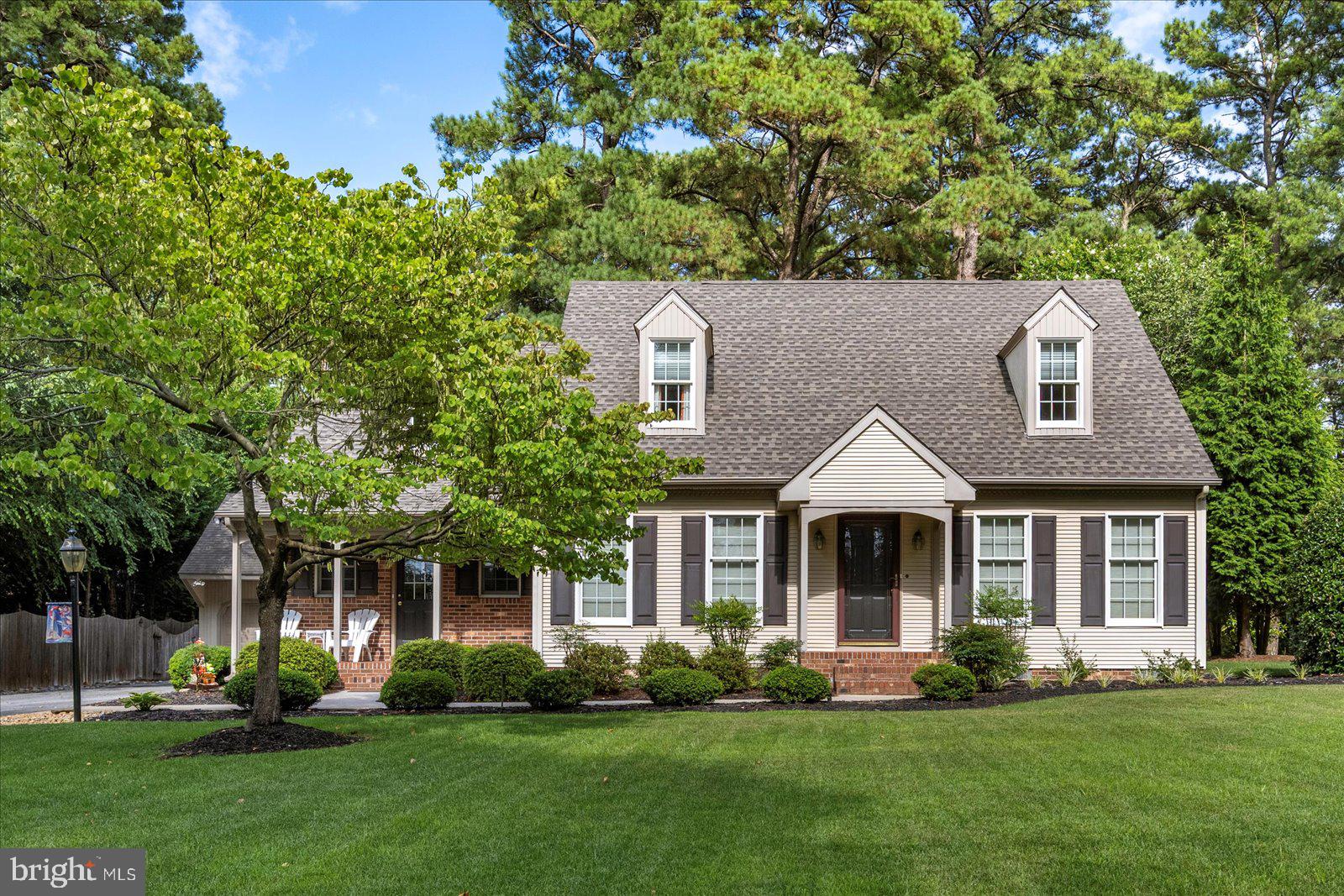 Well maintained and move-in ready, this 2523 SF, 4 bedroom, 2.5 bath cape cod w/ full back dormer is filled with natural light and inviting 1st floor living spaces that include a formal living room and dining room w/ charming French door entrances, a cozy study/den with built-in bookcase, a spacious eat-in kitchen w/ stainless appliances, pantry, and deck access, as well as a family room w/ deck access, masonry fireplace w/ gas log insert, and bookcase that leads to a secondary front entrance just off the half bath and laundry room. A hardwood staircase ascends to the bedroom level w/ hardwood flooring throughout and includes a spacious primary bedroom w/ vaulted ceiling, 2 closets and private updated bathroom, 3 additional bedrooms, and an updated hall bathroom. Other features include a 2-car detached garage w/ walk-up attic, paved driveway, a brick patio and brick walkway, a deck, in ground irrigation w/ private well, a separate well serving the dwelling, and public sewer. Roof replaced in 2023 (complete tear-off) and windows (Andersen) replaced in 2022. Conveniently located minutes from Downtown Salisbury, SU and area dining and shopping, this is just the place to call home! No city taxes.