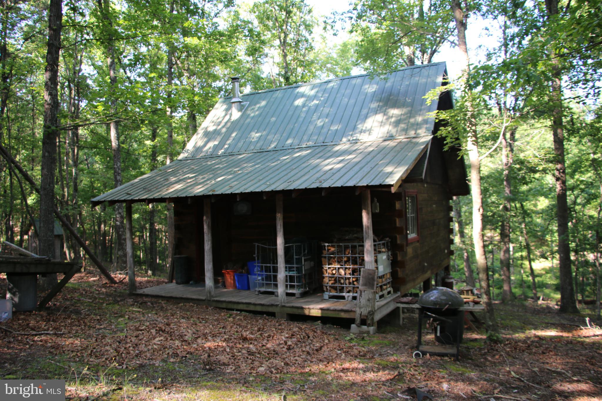 Own a piece of the beautiful Siler Heights community in Cross Junction. Located just minutes northwest of Winchester near Lake Holiday. Access is secured via extensive road frontage on Easter Ridge Lane. Features a fully functional hunting cabin with a wood stove and propane used for heating and cooking. The cabin has an open layout and separate sleeping quarters via a loft. Experience exciting hunting as many types of wildlife call this property home including deer, turkey, and many small game species. There are potential building sites located throughout the property. This tract is currently being used for recreation but it would also make an excellent site for your dream home or vacation rental. Stellar views of the surrounding countryside are attainable with some tree clearing. This property features mildly sloping topography which is builder friendly and allows for enjoyment of the land. Currently enrolled in the county’s forestry land use program to reduce the annual taxes. This is a fully wooded property that is zoned Rural Areas (RA). Enjoy hiking, camping, and recreation of all types on this land. A short drive from all the amenities and attractions Winchester has to offer.
***Additional adjoining acreage available for purchase. See aerials for details.***
***The land and cabin are being sold in AS-IS condition.***