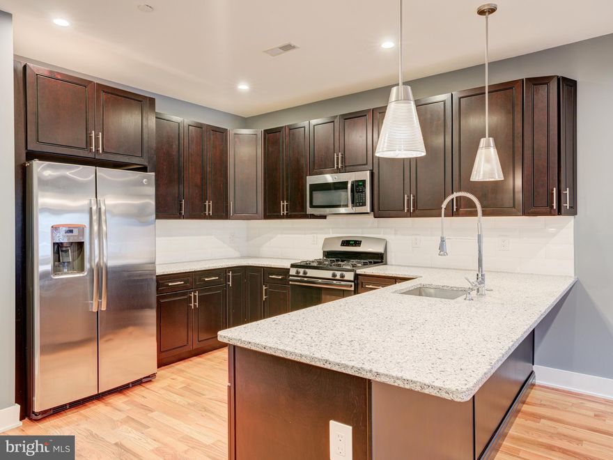 BEST location in South Kensington / Norther Liberties with PARKING and ROOF-TOP DECK !   Welcome to this stunning 3-bedroom, 3 full-bath custom-designed luxury condo in South Kensington, steps away from HOT Northern Liberties and walkable to Fishtown  — all three being of Philadelphia's most vibrant neighborhoods.  This is your chance to own a condo (which feels like a house) with private and coveted PARKING in the rear (surface space) with the huge benefit of affordability having approximately three years remaining on a tax abatement. Special features include a video doorbell system, a NEST thermostat, a cathedral ceiling, and custom blinds throughout. The open-air design creates a seamless flow between the spacious living, dining areas, and kitchen, with stunning oak hardwood floors, recessed lighting, and ceiling fans. The living room features a highly efficient fireplace, perfect for cozy winter evenings with modern open space. The chef’s kitchen is equipped with stainless steel appliances, an elegant quartz countertop, abundant cabinet space, and a breakfast bar. The first floor boasts a large bedroom and a full bathroom with exquisite ceramic tiles and a stylish vanity. Upstairs, the second floor features two generously sized bedrooms with ample closets, two full bathrooms with modern ceramic tile designs, and a master suite with a walk-in closet, a glass-door shower cabin, and a double vanity. A convenient utility room with a full-size washer and dryer is located next to the master bedroom. Take the stairs to your private roof-top deck, the perfect space to amazing city views, entertain guests, or watch 4th of July fireworks. Additional perks include a dog park conveniently located in the rear, easy access to public transit with a 10-minute walk to Girard Station (Market-Frankford Line), and proximity to the trolley and bus routes 47 and 57. The condo’s prime location has a walk score of 95, placing you near the restaurants, bars, and shops of Fishtown and Northern Liberties, with quick access to I-95 and I-676, and only a 1-hour, 10-minute train ride to New York City.     The Layout is ideal for roommates as each bedroom has its own full bath or for the couple with kids or just wanting that private home office or guest bedroom.  Don’t miss this rare opportunity to own a stylish condo with every amenity you need. Schedule your appointment today to view this extraordinary home  as it is vacant and easy to show !