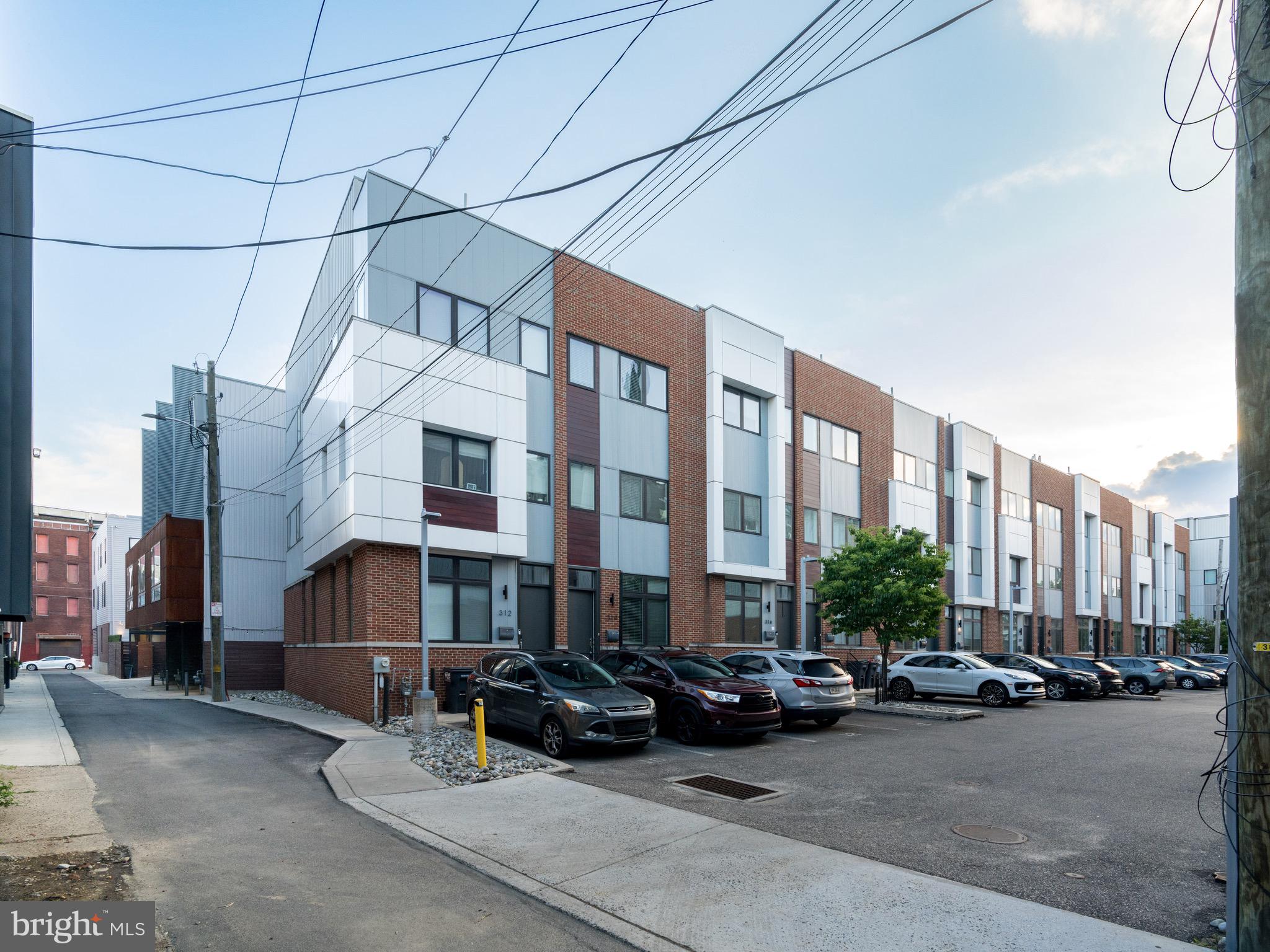 Built in 2017 with 2 years remaining on the tax abatement, this 3 bedroom 2.5 bath home with parking, finished roof deck, finished basement, and patio, is available for sale in one of Philadelphia's most vibrant neighborhoods, Northern Liberties. Nestled just off of N 3rd and Fairmount, you have the walkability to restaurants, shopping, parks and community amenities that all urban dwellers dream of. This home highlights several features: Hardwood floors and recessed lighting throughout, open concept floor plan with a high-end kitchen finished with Bosch appliances, built-in microwave cabinet, white Quartz counters, goose-neck spray faucet, deep stainless sink, peninsula with seating space and sconce lighting accent, and ample cabinetry. The upper levels include 2 spacious bedrooms and 1 bath on the 2nd floor and the main bedroom suite on the 3rd floor. Baths are styled with timeless tile work, cabinetry, and fixtures. The roof deck is the 4th level offering magnificent skyline views. The full finished basement is a wonderful addition and it includes the laundry room with front load side-by-side washer and dryer and a convenient half bath. Plan your visit. We are enthusiastic and motivated to sell.