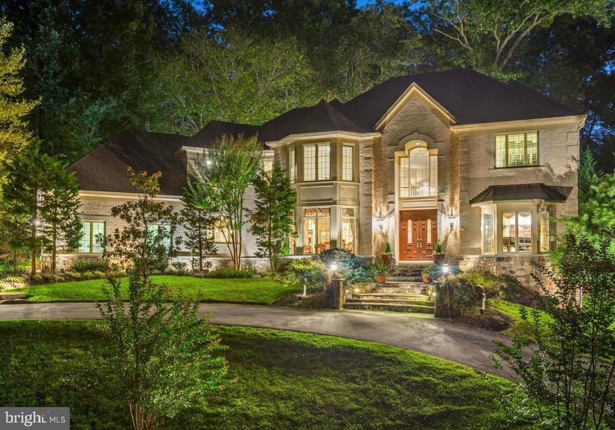 Nestled behind a conservation easement of trees  hidden off Bradley,  this magnificent 6500+ living square foot residence is surrounded by mature trees and lush greenery. A striking two-story grand foyer sets the tone for elegance, flanked by formal living and dining rooms designed for refined entertaining. The sunken family room is a showstopper—anchored by a stunning limestone tile fireplace. The heart of the home is the gourmet chef’s kitchen, appointed with top-of-the-line stainless steel appliances, rich cabinetry, and an expansive island. A  breakfast area overlooks a tranquil waterfall fountain and beautifully hardscaped stone patio—perfect for al fresco dining and outdoor gatherings. A main-level en-suite bedroom, powder room, mud-room and a private home office offer both comfort and convenience. Upstairs, the lavish primary suite is a true sanctuary, complete with a gracious sitting room and two oversized walk-in closets. Three additional generously sized bedrooms with two bathrooms and laundry room round off the upper level. The finished walkout lower level offers exceptional versatility, featuring a spacious recreation room, full bathroom, and endless potential for entertaining or multi-generational living. Generous size storage rooms. Impeccably maintained and thoughtfully designed, this home offers timeless luxury and modern comfort in a setting that feels worlds away—yet is just minutes from everything. 3 car garage with plenty of parking on driveway and on circular driveway in front of home. Winston Churchill School Cluster.  All offers due Tuesday (8/5) at 1pm.