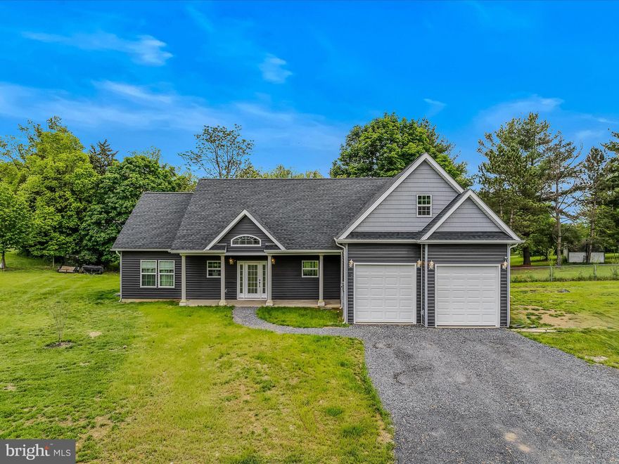 Why wait for new construction when you can move right into this nearly new home! The house was built in 2023 and on over 1/2 an acre. The long driveway provides ample parking space in addition to the two car garage. The house has a large front porch to enjoy a morning cup of coffee or an evening glass of wine. Inside you have a spacious foyer with LVP floors. Beyond this you have the large kitchen with LVP floors and recessed lighting. The large pantry provides plenty of extra storage. All of the appliances are stainless steel including the down draft electric range and microwave that are housed in the large center island. This provides extra prep space when cooking. The breakfast bar includes seats for four. The kitchen is open to the dining and living rooms. This a great set up for entertaining! The dining room features LVP floors and a sliding glass door to the rear yard. The spacious living room features vaulted ceilings, ceiling fan and gas fireplace. This will be the perfect place to stay cozy in the winter months. Down the hall you have 2 large bedrooms with carpet and overhead lighting. Both rooms have ample closet space for storage. The hall bath features an extended single bowl vanity for extra storage. The tub/shower includes a tile surround and floor is LVP. On the other side of the house, you have a large primary suite. The bedroom features carpet and a lovely tray ceiling. There's plenty of storage in the large walk-in closet. The private primary ensuite features porcelain tile. A set of 3 ft vanities will keep things nice and tidy. The 4 ft soaking tub will be relaxing after a long day and the 4 ft shower with tile surround is perfect for busy mornings. The large linen closet provides extra storage. The large laundry room off has access to the garage and features LVP floors and lots of shelving. Over the garage is carpeted bedroom four with a walk-in closet. It would also make a great family room or home office. This home has everything you have been looking for at the right price. Schedule your showing today!