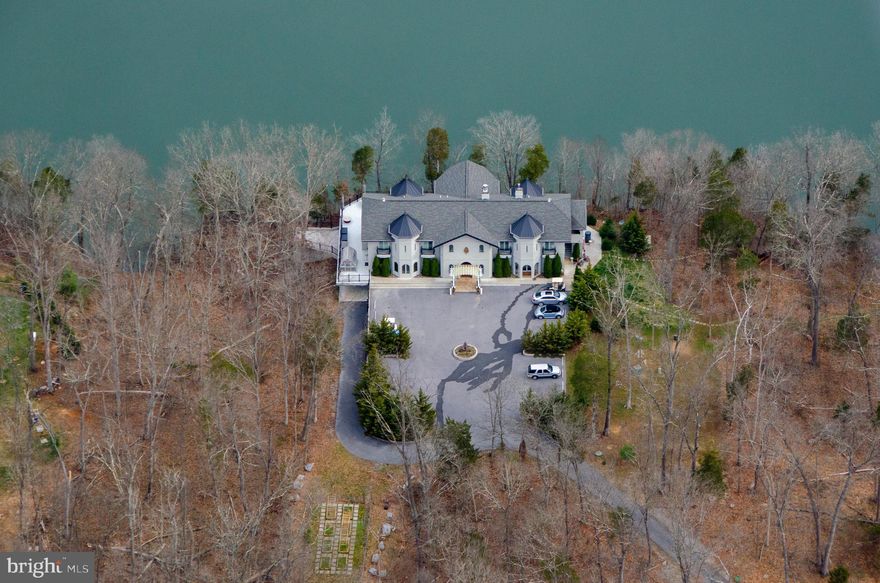 GRAYCLIFF HALL, custom designed by an architect in the style of a 15th century Italian "Costello",  was built in 2015 by Empire Construction.  Sited on 13+ acres fronting on the Potomac River,  it was designed to be spacious, elegant, comfortable, and suitable for family living OR business retreats.
 It was designed to provide fantastic 180 degree views of the POTOMAC RIVER. The view will never be spoiled, as the land on the Maryland side is part of the Federal  C+O Canal Park.  The main house has 13, 545 SF of living space on 3 levels and,  depending on need, with large meeting rooms, on each level. Also  a smaller guest cottage  and gate house with apartment for guests or managers. It is being sold FULLY FURNISHED with all operating equipment. 
 Graycliff Hall enjoys a spectacular 180*  view of the  Potomac protected by Federal C & O Canal on opposite side of the river. The 1st floor is mostly open space  with large elegant areas and rooms.  An elevator serves all three levels.  Highlights include a wonderful huge fireplace area with large couches and a big formal dining area.  Also a separate owners suite with kitchenette and office, a commercial grade gourmet kitchen, library and office. There is also a very large screened porch + huge decks with great  river views. 
 The second level has a large conference room and wet bar, 10 guest bedrooms (all have  balconies, 5 with river views).  The Lower level is largely finished as a recreational area with  a 24 seat theater room, 2nd office, open fitness area,  temperature controlled wine room, open game room with a full sized bocce court,  pool table and video games +an open conference area with  conversation pit. Also a covered parking area on the lower level.
  Multiple additional outbuildings, including a GATEHOUSE/APARTMENT, a GREENHOUSE,  a 2 bedroom  GUEST HOUSE on the edge of a large landscaped, stocked pond,  a MAINTENANCE SHOP with STORAGE, a GAZEBO. Equipment incl a canoe, kayaks, a pontoon boat, 3 golf carts, mowers extensive equipment and tools.  Sale includes a buyers  one year membership to Cress Creek Country Club. with golf, tennis, and pool facilities.    Graycliff is presently used both as a family residence and retreat center;  it serves as a perfect place to live and entertain family and friends;  a "retirement home to tempt the kids" with its outdoorsy, sporting lifestyle .  Truly your own private resort! It certainly will impress your business associates, even if they don't land on the HELIPAD  included on the property.   It provides a place where friends, families and business associates could feel comfortable  in a  beautiful  natural environment, where kids could feel comfortable bringing their friends and their own families.  Perfect for a business residence or  corporate retreat center.  
No matter the use, we guarantee that you will love the  natural beauty,  privacy  and the quiet atmosphere of this  grand property. As John Burrows once wrote, "I GO TO NATURE TO BE SOOTHED, AND HEALED, AND HAVE MY SENSES PUT IN ORDER."

Graycliff Hall is located within the Shepherds Cove residential community; a gated community with premium amenities, including extensive  walking trails, and a community recreational area which fronts the Potomac River and includes a marina, community boat storage area, putting green and pavilion overlooking the river.
Historic Shepherdstown  has a vibrant downtown area with  a wide variety of restaurants and boutique shops. It is the home of Shepherd University.
 Conveniently located 50 miles from the Washington DC Beltway, and minutes to Shepherdstown MARC train commuter service to DC. 
 For travel by air there is an Eastern West Virginia Regional Airport, easy access to Dulles International Airport ( IAD) , Baltimore Washington International Airport National Airport , and Washington County Airport (HRG) and of course Graycliff Halls' own helipad. 
Can be used as a retreat center.