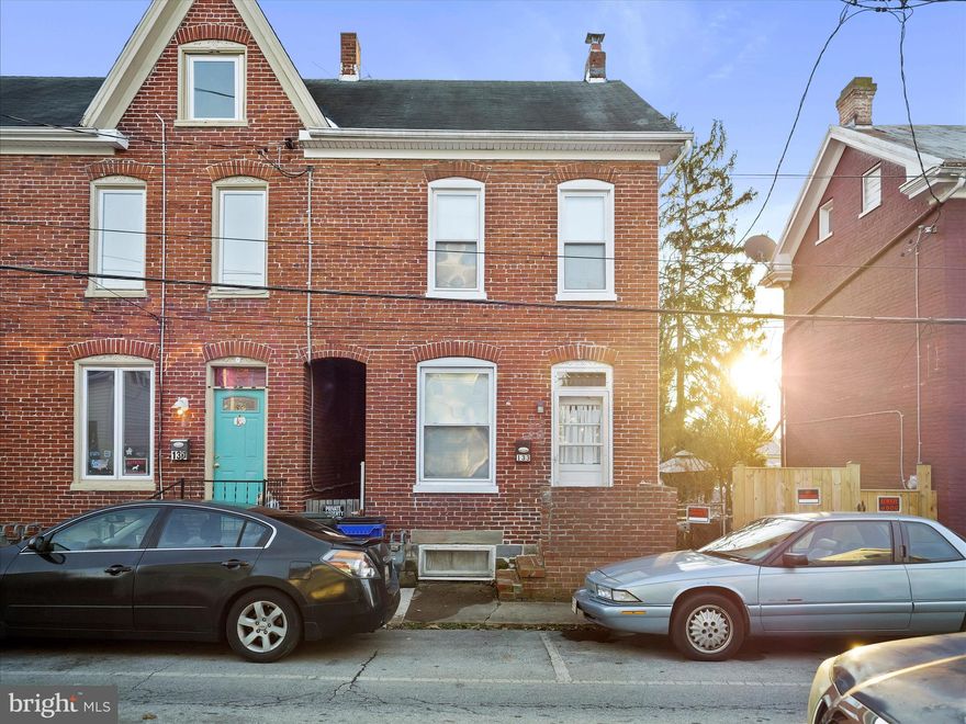 Welcome to this beautifully maintained all-brick end-unit townhouse within the city of Hagerstown! Situated on a 0.10-acre lot with a large partially-fenced backyard. The main level features hardwood flooring throughout, including a spacious living room and separate dining room. The kitchen is well-equipped and features provides access to a covered back deck. 
Upper level includes three generously-sized bedrooms, all with ample closet space, plus a large full bath with a tub-shower combo and double vanity. A fully finished attic provides additional usable space providing endless possibilities. The unfinished basement includes laundry and a walkout to the backyard, offering additional storage space. Newer windows throughout the home provide added efficiency and natural light.
Convenient location close to local amenities, commuter routes, and Fairgrounds Park. Don't miss your chance to call this home — schedule your tour today!