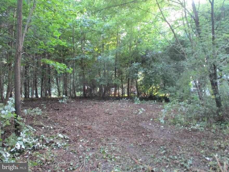 Vacation Where You Live! Enjoy Daily Walks Down The Beautiful Mature Tree Lined Streets Just One Block From The Water & Community Beach Access of Chesapeake Haven With Spectacular Views of the Chesapeake Bay! Easy Access Corner Double Lot 100'x125' Two Lots Total 0.286 Acre with Old Well & Septic (Integrity Unknown) Property Had a Beautiful Home That Was Destroyed in a Storm  Several Years Ago By a Fallen Tree, The Lot Was Cleared At That Time But The Home Was Never Rebuilt So The Well & Septic Are In Place But Have Not Been In Use Since. See Attachments For County Documents Regarding Demolition Which Indicate The Well And Septic Were Kept In Place For Future Use. Property Is Sold As-Is. Old Location Drawing Is Provided In Attachments For Lot Dimensions. As Per Cecil County Planning & Zoning (see in attachments) a Double Wide Manufactured Home On Permanent Foundation Is Permissible. There is a Voluntary Community Association Fee to Help with Roads and Beach Maintenance and Average $200 per year.