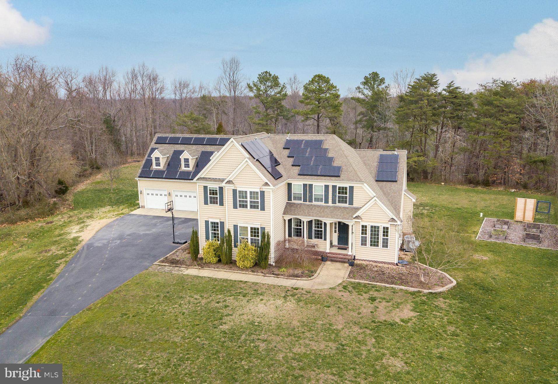 Looking for lots of space? Here it is. This home has great space inside and out. Sitting at end of street in the culdesac on a little over and acre, backing to trees, in a water priviledged community. Welcoming two story foyer flanked by a formal living and formal ding area. Large Family room with gas fireplace is adjacent to the grand kitchen with custom cabinets, stainless steel kitchen aid appliances, granite counters , and huge center island. On rear of home you will find a second extra large family room. Master is also on main level with en-suite bath and extremely large walk in closet. Hardwood flooring throughout main level. Second story with second master suite, plus two additional bedrooms and full bath. Basement is partially finished with an 800 sq foot theater(all theater equipment will convey) plus a full bath. There is an additional 1700 sq ft of space for you to use as you desire. Did I mention the 1200 sq ft 3 car garage? Loft above is ready for heat and a/c. and your finishing touch. Paver patio out back and a nice level back yard. Community pier and access to Breton Bay. This is a great place to call home!!
