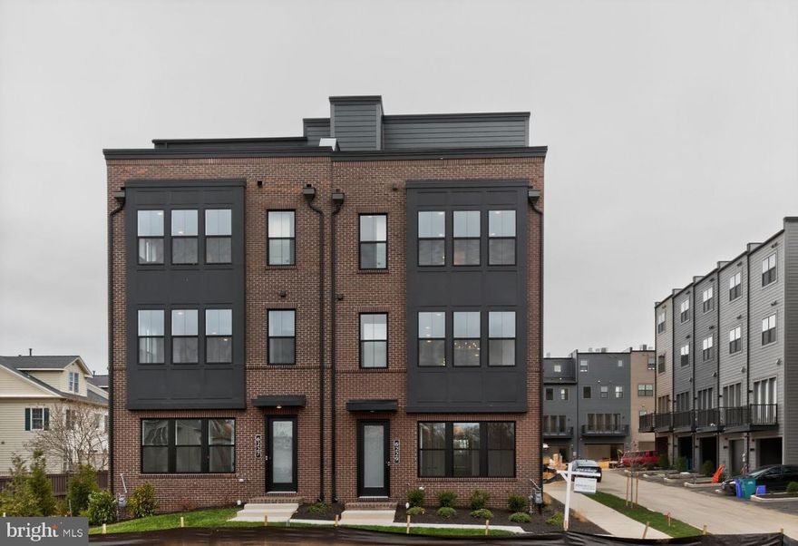 This stunning end-unit home is designed for effortless entertaining, featuring a bright, open main level with a spacious great room, dining area, and a beautifully appointed rear kitchen ready for your personal design selections.