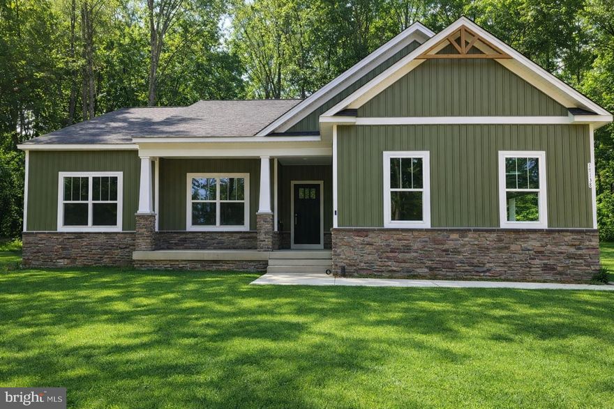 LAKE ANNA – WYNDEMERE LAKE COMMUNITY –YOUR DREAM HOME IS TAKING SHAPE. The Clayton model by award-winning Foundation Homes is currently under construction and scheduled for completion in mid-May 2026, just in time for boating season. This stunning ranch-style home with a fully finished walk-up basement offers over 3,300 square feet of living space, four bedrooms (1 NTC -septic), and three full baths.  From the inviting craftsman-style front porch, step into an open-concept family room featuring soaring cathedral ceilings and luxury vinyl plank flooring throughout the main living areas. The gourmet kitchen is beautifully appointed with white shaker-style soft-close cabinetry, quartz countertops, stainless steel appliances, a wall oven, built-in microwave, cooktop range, and a spacious island ideal for cooking and entertaining. The main-level primary suite offers two closets, dual vanities, and a thoughtfully designed shower for a spa-like experience. A secondary bedroom and a flex room (not to code due to septic) complete the main level and offer versatility for guests or home office space. The fully finished lower level features an expansive recreation room, oversized media room, full bath, a large additional bedroom, and abundant storage. Enjoy peaceful evenings on the covered composite rear deck while taking in the tranquil natural setting, or take a short walk to one of the 3 marinas with a boat launch. Wyndemere is a sought-after lake community at Lake Anna, and offers many amenities for the whole family, waterfront picnic areas, basketball, tennis, and pickleball courts, 3 marinas, and boat slips you can lease annually.  It is ideally located, just minutes from shopping, dining, and popular local destinations including Lake Anna Winery, Tim’s, The Cove, Lake Anna State Park, and more. XFINITY Internet available!  *Photos are of a similar home and not exact; please see the Documents section for specific selections and finishes.