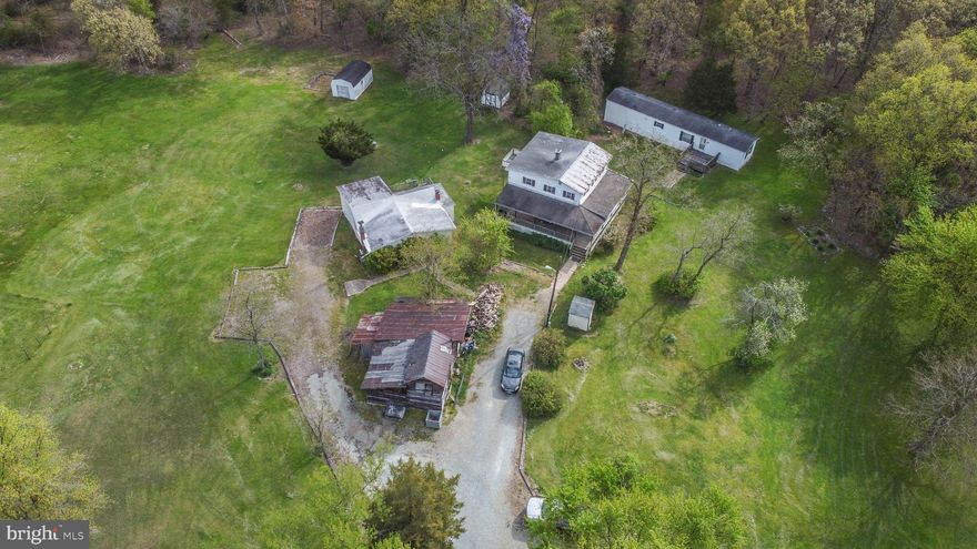 ***IT IS SUBDIVIDABLE ***

**Welcome to a slice of historic ,rustic paradise nestled in nature's embrace! This sprawling 9.23-acre property is an adventurer's dream, offering a unique blend of history, potential, and natural beauty. A total of 3 homes on this property. The property has a rich history of roots that go back to the civil war and sits up against the girl scouts retreat for Cecil County.
**The main farmhouse, has 3 bedrooms and 3 baths, carries the charm of yesteryears but is ripe for a modern transformation. With an expansive basement that could easily be converted into a cozy apartment, it has a kitchen, bathroom, and private entrance already. The possibilities are as vast as the surrounding wilderness.
**In addition to the farmhouse, there's another 2-bedroom, 1-bath, house awaiting restoration after a roof leak. While it needs some TLC, this second dwelling holds its own historic allure.
**For those seeking comfort and convenience, a well-maintained 2-bedroom, 2-bath mobile home stands on concrete footers, offering a cozy retreat amidst the natural splendor.
**Imagine waking up to the sounds of wildlife, surrounded by trees and open skies. This property, approved for subdivision, presents a canvas for your imagination. Whether you envision a revitalized farmstead, a private retreat, or a haven for outdoor enthusiasts, this land beckons to be cherished and revitalized.
**Seize this opportunity to embrace the rustic allure, unlock the hidden potential, and write the next chapter in this land's storied history. Discover the magic of country living with a touch of nostalgia and endless possibilities!