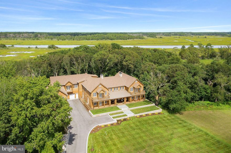 Extreme attention to architectural detail while carefully blending old world design & materials with every modern amenity and refinement, this 12,500 square foot home has over 2,500 square feet of decks and porches, complementing exquisite shaker inspired details, with expansive custom glass windows, French doors and Nana Walls bringing the beauty and natural splendor of the original Japanese Black Pine forest of the Cape region and the expansive vistas of the Cape Henlopen state park into a truly breathtaking experience.   Designed by a hidden gem local architect, the home is completely clad in cedar with stone foundations, in a manner consistent with the great homes of colonial Delaware and the coastal mid-Atlantic region. The stately front porch, with step off grading to a dignified front yard, opens into a great room with soaring cathedral ceilings over thirty feet in height.  Two, eight food wide stone chimneys, with look through expansive wood burning fireplaces and raised hearths bookend the over 1,000 square foot great room.  Exposed trusses and a custom-built wrought iron gas lamp lens chandelier greet you as you gaze through the back Nana Walls, French doors, and porches to the exquisite natural beauty beyond.                                                                                                                                                   This home truly has everything and more.  From an over 800 square foot gym, 1,000 square foot plus Saloon complete with leathered marble bar that seats 12, a 3,000+ wine bottle wine cellar, to walk in closets in the primary suite that expand across two levels and encompass over 600 square feet of space.  The gourmet chef's kitchen includes professional grade appliances, island seating for over 10 and flows across a siting area, morning room and screened in dining porch.                                                                                      .  Designed for multi-generational gatherings or exceptional entertaining, parking for over 10 cars in the motor court greets your family and guests, connecting an expansive attached three car garage to a detached two bay outbuilding, with caretaker/mother-in-law suite above.  Providing ample indoor space for on-sand, off-road, in-town vehicles, or other toys.   This home is a dream for extended family vacations, weekend getaways for large groups or truly exceptional entertaining on a grand scale.   Close to award-wining dining in historic, centuries old downtown Lewes, DE, world-class fishing grounds, white sandy beaches, and exceptional hunting; this is an outdoor family?s dream destination.  Easily accessible to Manhattan, Washington, DC, and the northeast corridor.  Less than 30 minutes' drive to the Delaware Coastal Airport, with its recently lengthened 5,500-foot runway, allowing easy access from New York, Boston and beyond.