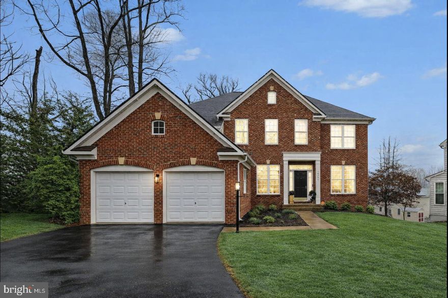 Rare cul-de-sac opportunity! Stunning brick-front colonial tucked away in Historic Triangle just minutes from Quantico. Offering over 4,300 finished square feet across three spacious levels, this beautifully designed Beazer Farnham model features a dramatic two-story family room, gourmet kitchen, private office, walk-up finished basement, and large backyard backing to peaceful wooded views. Minutes to Quantico with convenient commuter access to I-95, VRE, and major commuter routes.

The main level welcomes you with a hardwood foyer, formal living room, and elegant dining room accented with chair rail and crown molding. The impressive two-story family room showcases soaring ceilings, abundant natural light, recessed lighting, ceiling fan, and a gas fireplace creating a warm and inviting gathering space.

The gourmet kitchen offers granite countertops, gorgeous cabinetry, stainless steel appliances, gas cooktop, double wall ovens, microwave, dishwasher, refrigerator, pantry, breakfast bar, and a built-in desk area. The breakfast area opens to a spacious deck overlooking a beautifully designed stamped concrete patio—perfect for relaxing or entertaining.

A private office or study currently used as a bedroom features hardwood floors, a bay window, French doors, and a transom window. The main level also includes an upgraded powder room and an expansive laundry/mudroom.

The upper level features a catwalk overlooking the family room and a luxurious primary suite with treetop views, ceiling fan, sitting area, two walk-in closets plus a linen closet, and a spacious ensuite bath with dual granite vanities, an oversized soaking tub, a luxurious walk-in glass shower, and a private water closet. Three additional generously sized bedrooms and a full hall bath complete the upper level.

The fully finished walk-up basement offers a bright and expansive recreation room, remodeled full bath with stand-up shower, an NTC bedroom, and generous storage space.

The fully fenced backyard backs to peaceful wooded views, offering privacy and flexibility for outdoor enjoyment.

Conveniently located near Graham Park Pool, parks, and schools, this home is minutes to Quantico with convenient commuter access to I-95, Route 1, Route 234, commuter lots, Metro bus routes, and VRE service to Fort Belvoir and the Pentagon. Enjoy nearby shopping and dining at Potomac Town Center, Wegmans, and Potomac Mills Mall, all just a short drive away.

Spacious, light-filled, and beautifully positioned—this exceptional home offers the perfect blend of privacy, comfort, and commuter convenience in one of Triangle’s most desirable established neighborhoods.