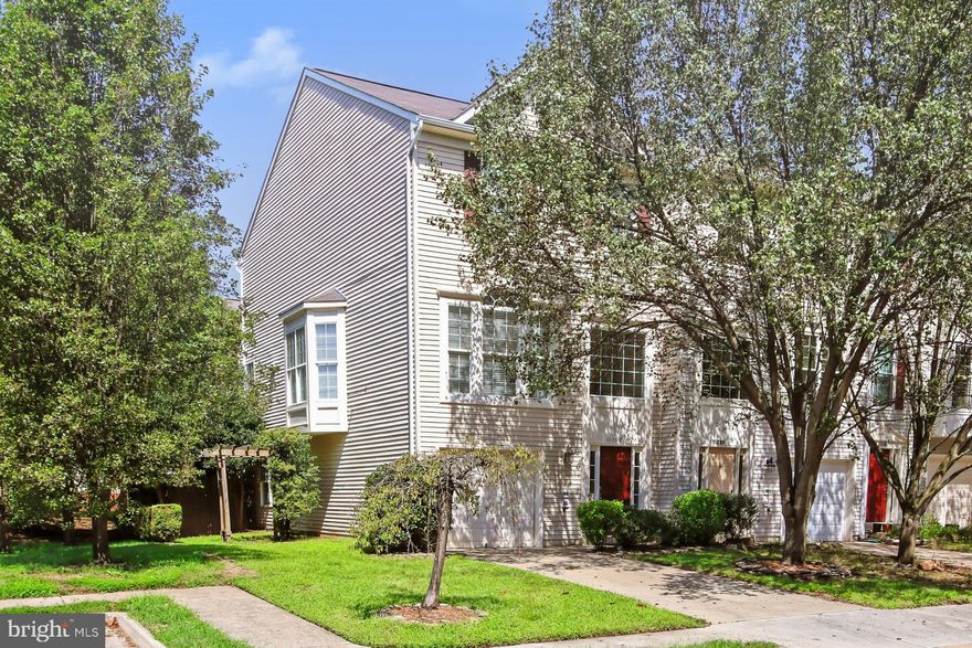 Nestled on a quiet street in the Paradise neighborhood, this 3 bedroom, 3 bath end-unit townhome delivers classic design sprinkled with contemporary flair. A tailored façade, attached garage, two-level deck, an open floor plan, three-level bump-out, designer finishes, custom built-ins, and an abundance of windows are just some of the fine features that make this home so appealing, as loving maintenance and on trend neutral paint create instant appeal. 

A grand two-story foyer welcomes you home and ushers you upstairs and into the living room featuring a Palladian window streaming natural light. The dining area offers space for all occasions  as a dry bar with wine chiller and candelabra-style chandelier add a distinctly refined flair. The sparkling kitchen is sure to please with Corian countertops, extensive cabinetry, and stainless steel appliances including a gas range and French door refrigerator. Enjoy morning coffee at the center island’s breakfast bar, in the adjoining breakfast area, or ease into the family room where a corner fireplace serves as the focal point. Here, a glass-paned door opens to the deck with corner railing pergola and descending stairs to a lower level deck, fenced-in corner lot, and beautifully maintained historical green space beyond—seamlessly blending indoor and outdoor entertaining or simple relaxation. 

Upstairs, the gracious owner’s suite boasts a soaring vaulted ceiling, sitting area, walk-in closet, and a private bath with a dual-sink vanity, sumptuous soaking tub, glass-enclosed shower, and spa-toned flooring and surround. Down the hall, two additional bright and cheerful bedrooms, each with plush carpet and generous closet space, share access to the well-appointed hall bath, while a bedroom level laundry closet eases the daily task. The walkout lower level recreation room offers plenty of space for media, games, and exercise, as an additional full bath, direct garage access, and ample storage space complete the comfort and luxury of this wonderful home.

All of this is conveniently located near the Prince William Parkway, VRE, an easy drive to Route 28, and in close proximity to plenty of diverse shopping, dining, and entertainment choices in downtown Manassas. Outdoor enthusiasts and history buffs alike will appreciate the 5,000 acres of natural beauty just waiting to be explored at nearby Manassas National Battlefield Park or you can spend an afternoon at the local breweries and wineries—there’s something here for everyone. For a suburban retreat that offers sophistication and comfort, come home to Wainwright Place!