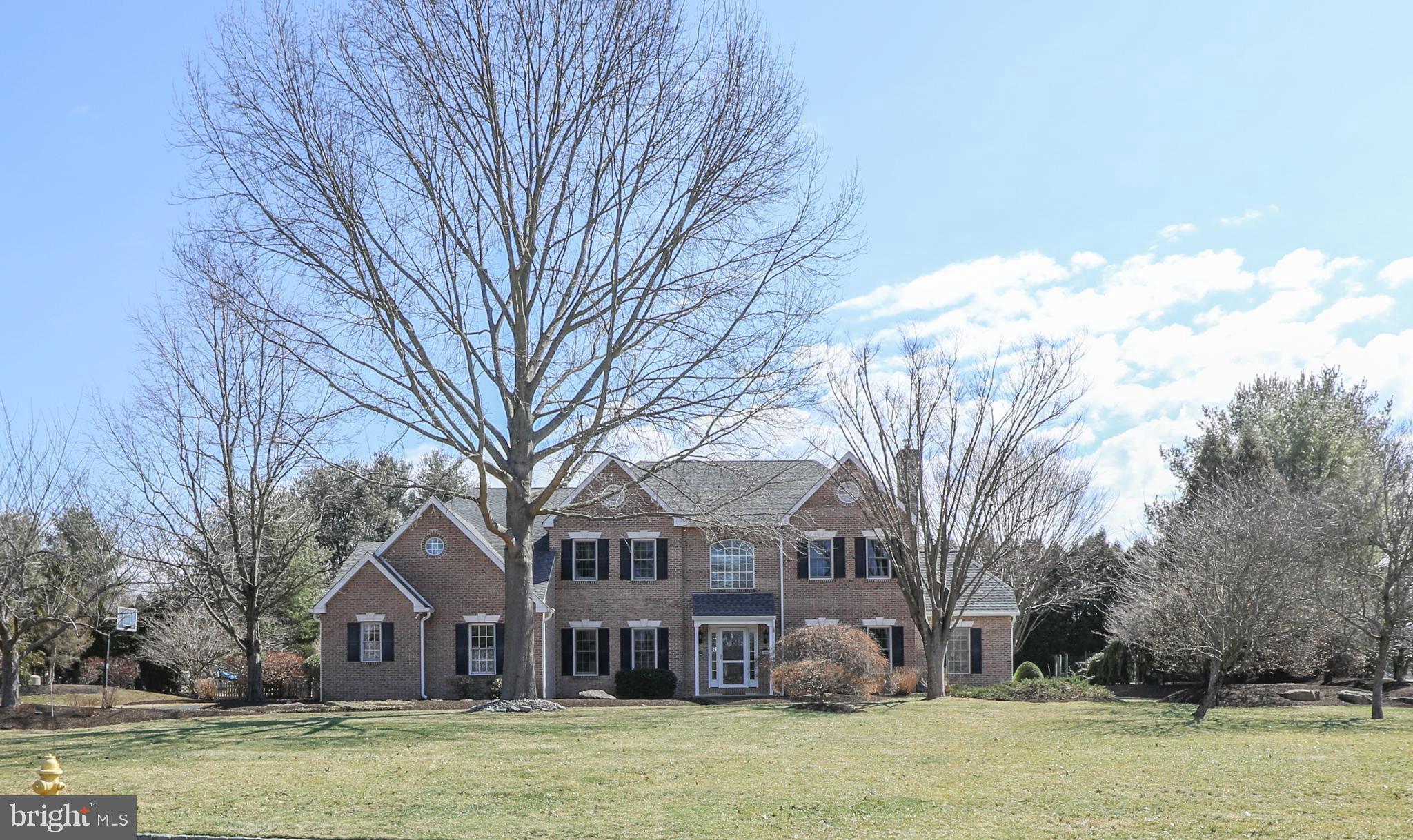 Spacious & stately brick front center hall Colonial with an open floor plan and great location make this home worth the wait! Located minutes from Doylestown Boro, this gem of a neighborhood offers minimal street traffic, walking paths connecting to the Boro as well as to Pine Run Reservoir with sports fields and playgrounds, Del Val University, and just a 3 minute car ride to Central Bucks Elementary, Middle and High School, as well as Peace Valley Park/Lake Galena. Showcasing a grand two-story entrance with hardwood floors throughout most of the first floor, you’ll find a cozy Living Room complete with a gas fireplace on the right, which leads you to a perfectly sized home office with vaulted ceilings. An open Dining Room with a tray ceiling and Butler' s Pantry is on the left, which leads you to the updated Eat-In Kitchen - the heart of the home. Graciously sized and perfect for cooks, the Kitchen offers gas cooking, stainless appliances, double oven, ample granite countertops and cabinetry galore. The Kitchen opens to the Great Room with soaring vaulted ceilings and a gas fireplace, flanked by windows which overlook the backyard. There’s also a pleasant Sun Room tucked away that would be a sweet spot for morning coffee or could be a second home office, playroom, yoga/exercise room…whatever strikes your fancy! The nearby Powder Room is handy as well as the main floor Laundry Room off the Kitchen, with an entrance to the three-car oversized Garage on one end and a backyard entrance on the other end. A lovely patio off the Kitchen encourages outdoor entertaining and summer barbecues plus an awning to keep you comfortable. A beautiful turned staircase brings you to the second floor, where we’ll start with the Owner’s Suite - complete with vaulted ceilings, a sitting room, a large walk-in closet, and an updated Owner’s Bath with a tub, granite double sink vanity, tiled shower, separate WC and a linen closet. Head down the open hall that overlooks the Great Room and the Foyer, and you’ll find a roomy second Bedroom with an updated Ensuite Bath. Next are the graciously sized Bedrooms three and four, as well as an updated hall Bath with double sinks and a tiled shower/tub. A full unfinished Basement provides plenty of storage, or an opportunity to create something that speaks to you. The home is well appointed with custom millwork, abundant windows allowing for tons of natural light, an easy flowing open floor plan and has been updated throughout. The one acre lot is perfect for yard games, sports playing, gardens or stargazing. Experience the “Best Small Town Cultural Scene'' that Doylestown Boro has to offer and take advantage of the central location to nationally recognized Doylestown Hospital, award winning Central Bucks School District and the many museums, restaurants, cultural events, local shopping, commuter roads and trains/rails that living in this home provides. You're not just buying a home, you're buying a Lifestyle....A must see home!