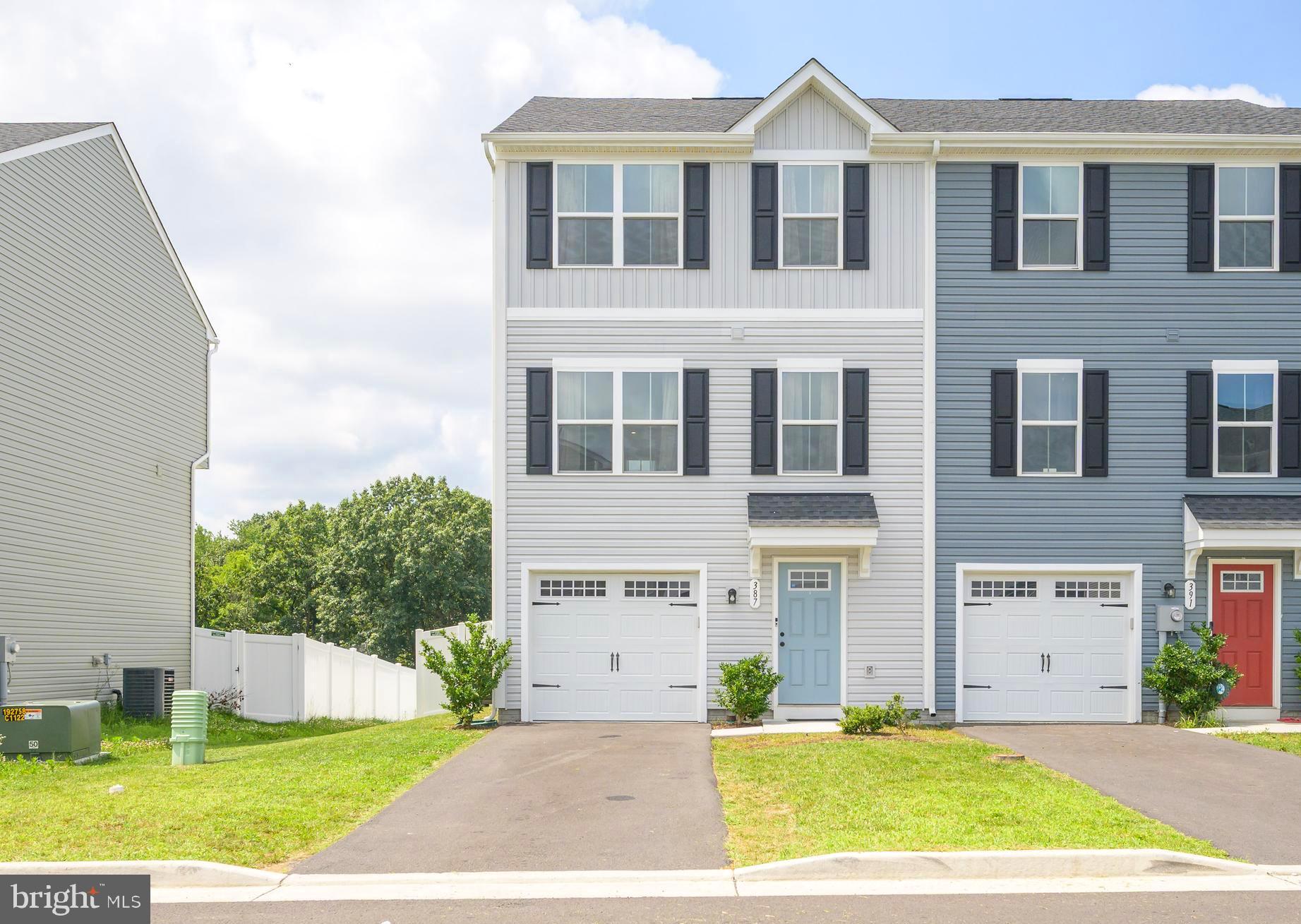 This lovely, end-unit townhome is just two years young. Over 1,500 square feet of living space highlighted by the bright and open main level layout, yet it still offers opportunities for privacy and separation. The entry level features the perfect spot for a den or office space. Here you will also find a large utility/storage closet. On the main living level, the great room opens to the kitchen and dining areas making it perfect for gathering friends or family. There is also a half bath conveniently located on this level. Upstairs there are three bedrooms. The primary suite features an ensuite bathroom with walk-in closet. The other two bedrooms share the hall bathroom. And all have easy access to the laundry on this level. You will find yourself spending as much time as possible outside though in the large, fenced yard perfect for entertaining, gardening, playing, or pets. The large paver patio is ideal for grilling or just chilling. This home is move-in-ready with fresh paint and draperies included. All this home has to offer is tucked into a quiet neighborhood, but within minutes of major commuter routes.