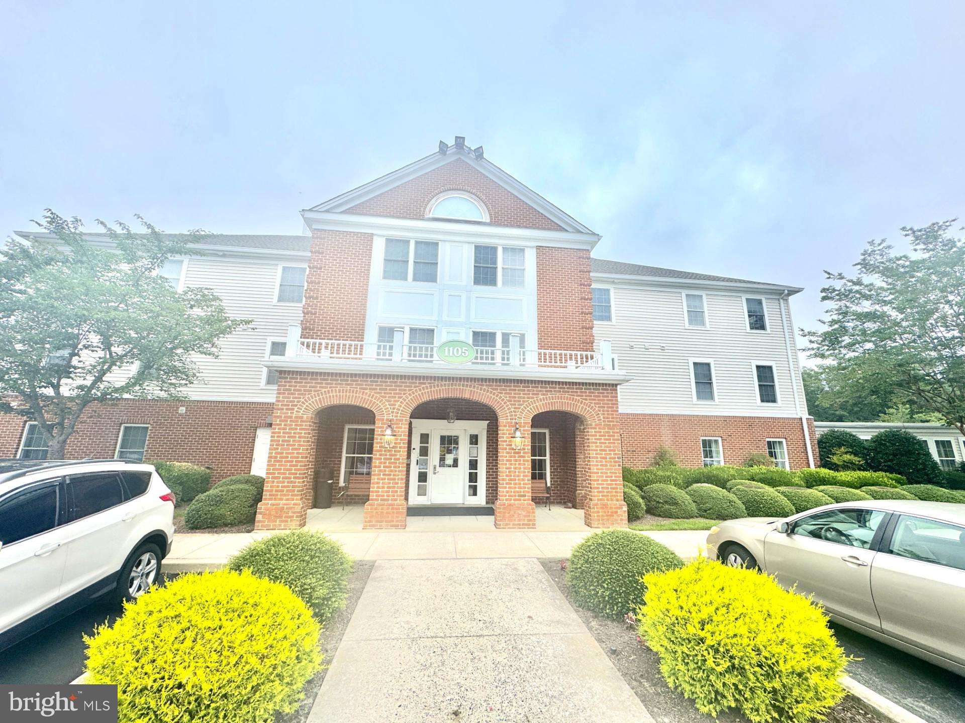 This well maintained Stockton floor plan features 1 bedroom, 1.5 baths, plus a spacious den with custom built-ins—perfect for an office or guest space. Freshly painted and located on the first floor, this unit offers the convenience of no elevator needed, with pond views of scenic Schumaker Pond right from your windows. Enjoy a compact laundry room, open living space, and easy access to your garden-level storage unit via elevator if needed. Just steps from the clubhouse, this building is the closest to community amenities, including two dining rooms, planned social activities, outings, Happy Hours, exercise programs, and more.