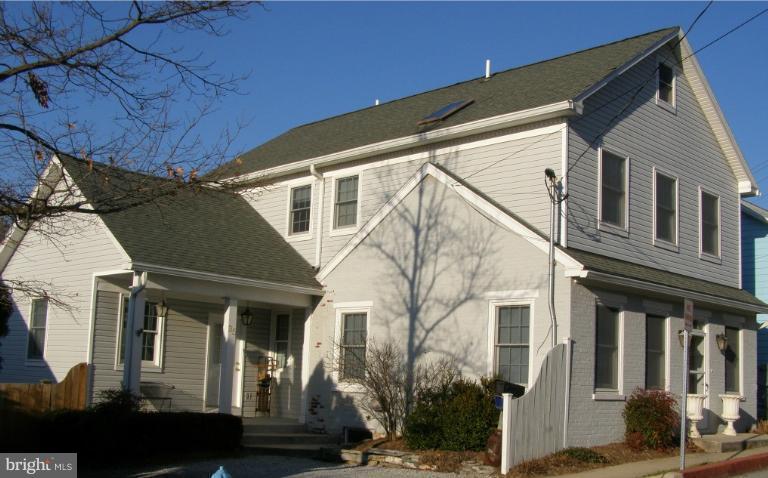 Unprecedented quality & attention to detail. This home boasts large bedrooms, marble baths, huge master suite, gorgeous hardwood floors, chair rail, crown molding and gas fireplace. Open kitchen with cherry cabinets & corian countertops. French doors open to a spacious deck & beautiful fenced backyard. Close to a new state of the art gym, local restaurants & shops.