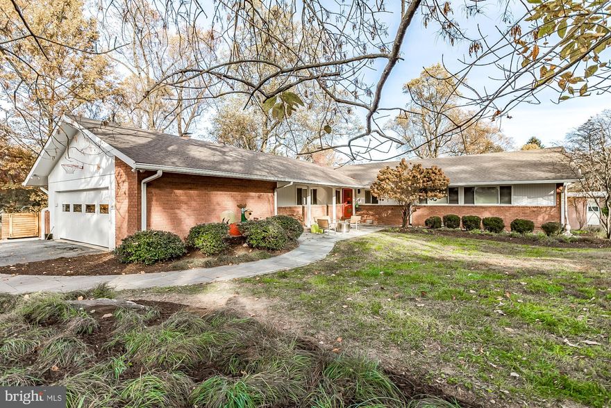 Sublime Mid-Century Modern dream home boasts the best of main-level living. Beautifully and thoughtfully renovated, sprawling brick rancher with stone patio and porch entry, Four Bedrooms, Family Room, eat-in Kitchen, Living Room and Dining Room with picture window overlooking the full-length wood deck with garden beds and irrigation system, bluestone patio, outdoor shower, hot tub and welcoming back yard. Luxurious Primary Bathroom boasts a soaking tub and separate shower. The finished, walkout Lower Level  could be an in-law suite or second Family Room and currently serves as a spacious yoga and exercise room, complete with three-person glass sauna and half-bathroom.  Included is a propane-fueled backup generator that can serve approximately 75% of the house's energy needs. Oversized, attached two-car Garage and private driveway for multiple vehicles. Showings begin Friday, November 10th.