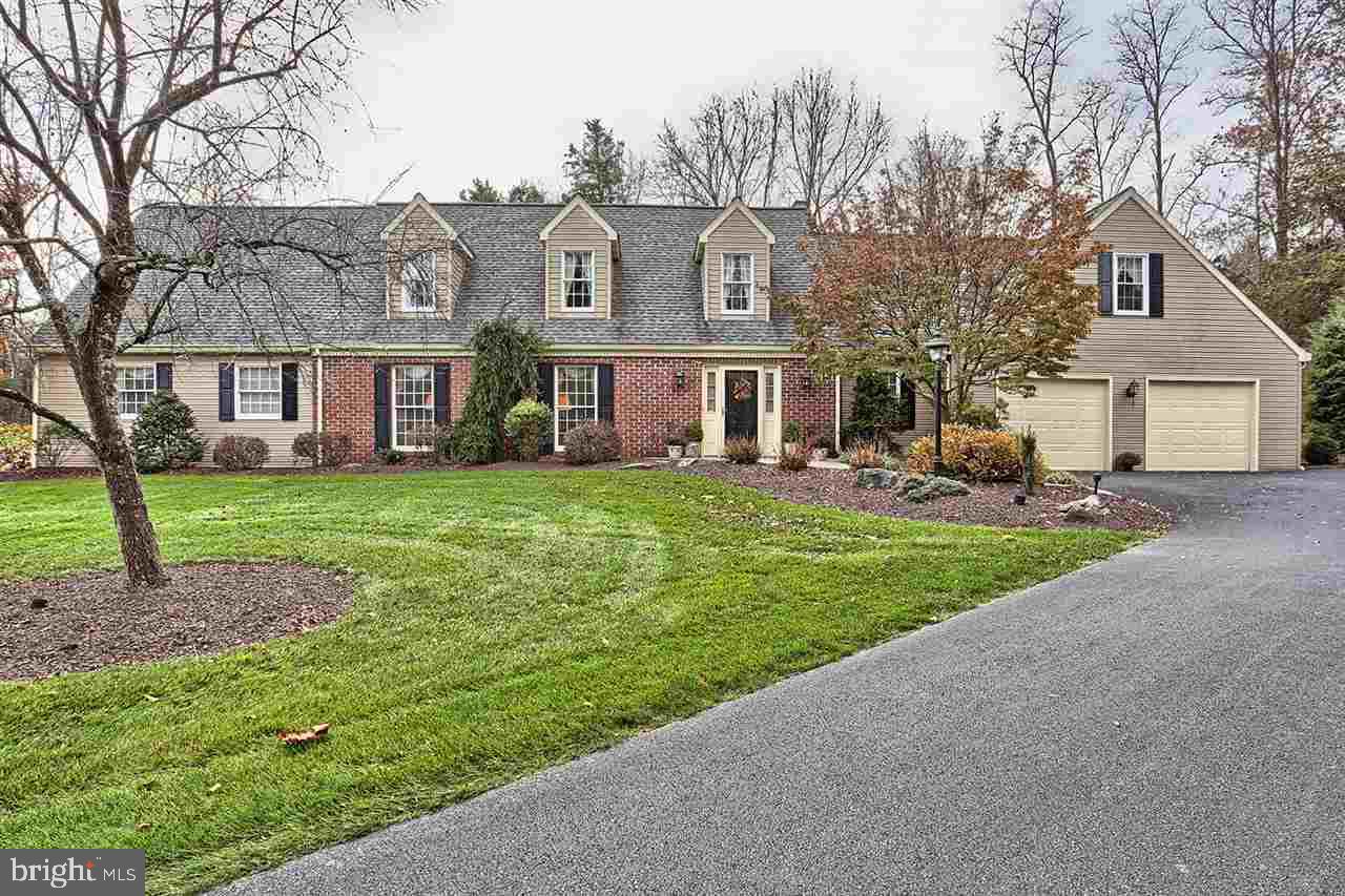 Magnificent custom built cape cod on over 5 acres in secluded area. Spectacular grounds with stream and water feature. Kitchen and baths have been updated, hardwood flooring, very spacious 1st floor master suite, sunroom and 24.3x14.10 screened porch, plus additional covered patio to enjoy the sound of water fall. 4 car garage.