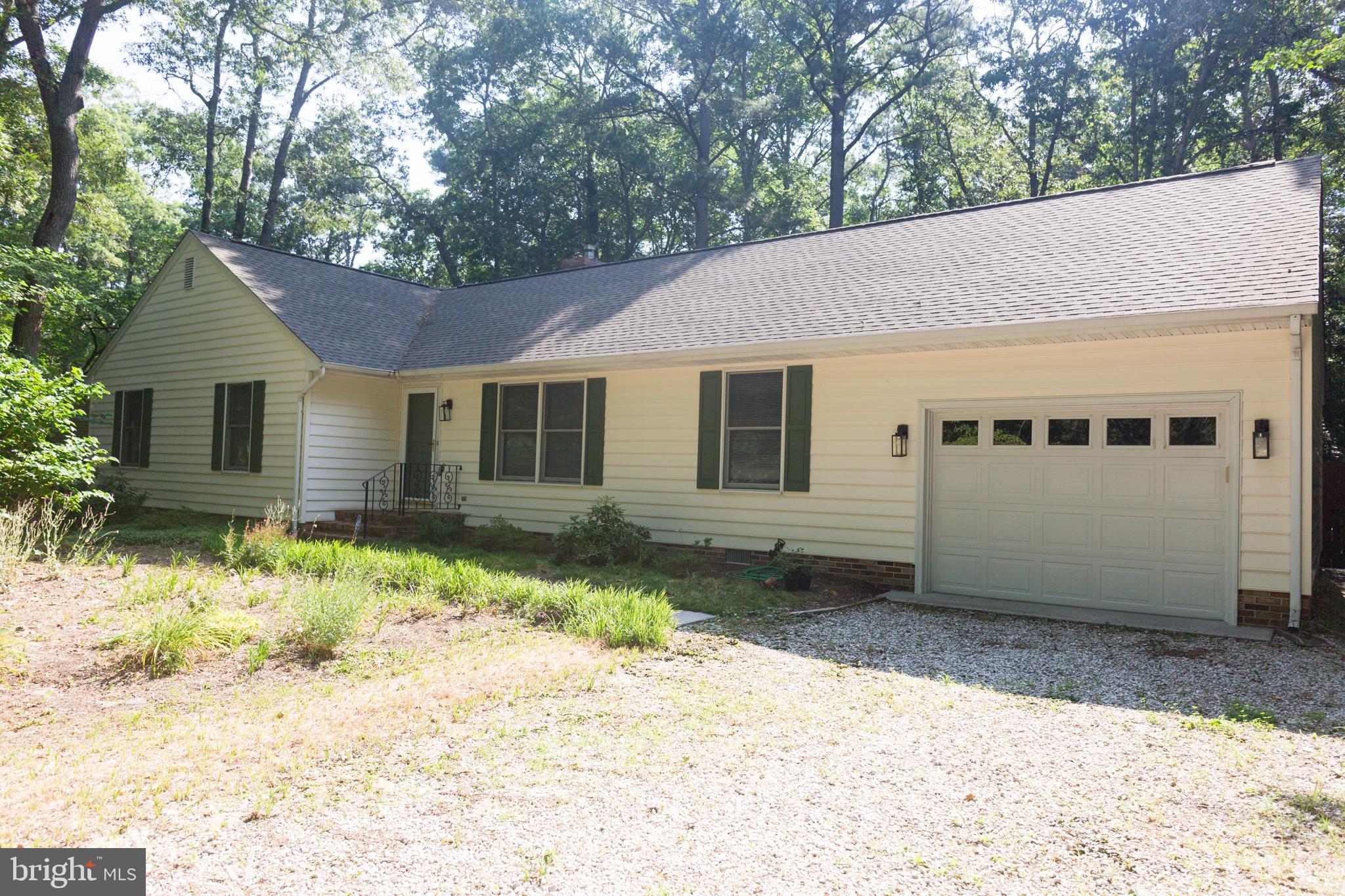 GREAT LOCATION! EASY ACCESS TO BERLIN, OCEAN CITY AND MINUTES AWAY FROM THE AIRPORT. AMENITIES INLCUED ARE: ADT alarm system, Pella Front Door, Wood Shed full of cut wood, Raised beds for gardening, Anderson Windows, Newly Relined Chimney cleaned for Wood Stove, Fenced in Back yard, Septic was replaced in 2023, architectural shingle Roof was replaced in 2021, Water Heater was recently replaced. Wood Deck with ramp access. FIre Pit in Back Yard. Mulitple Walk-in Closets! A great place to call it your own. Call us for a tour today.